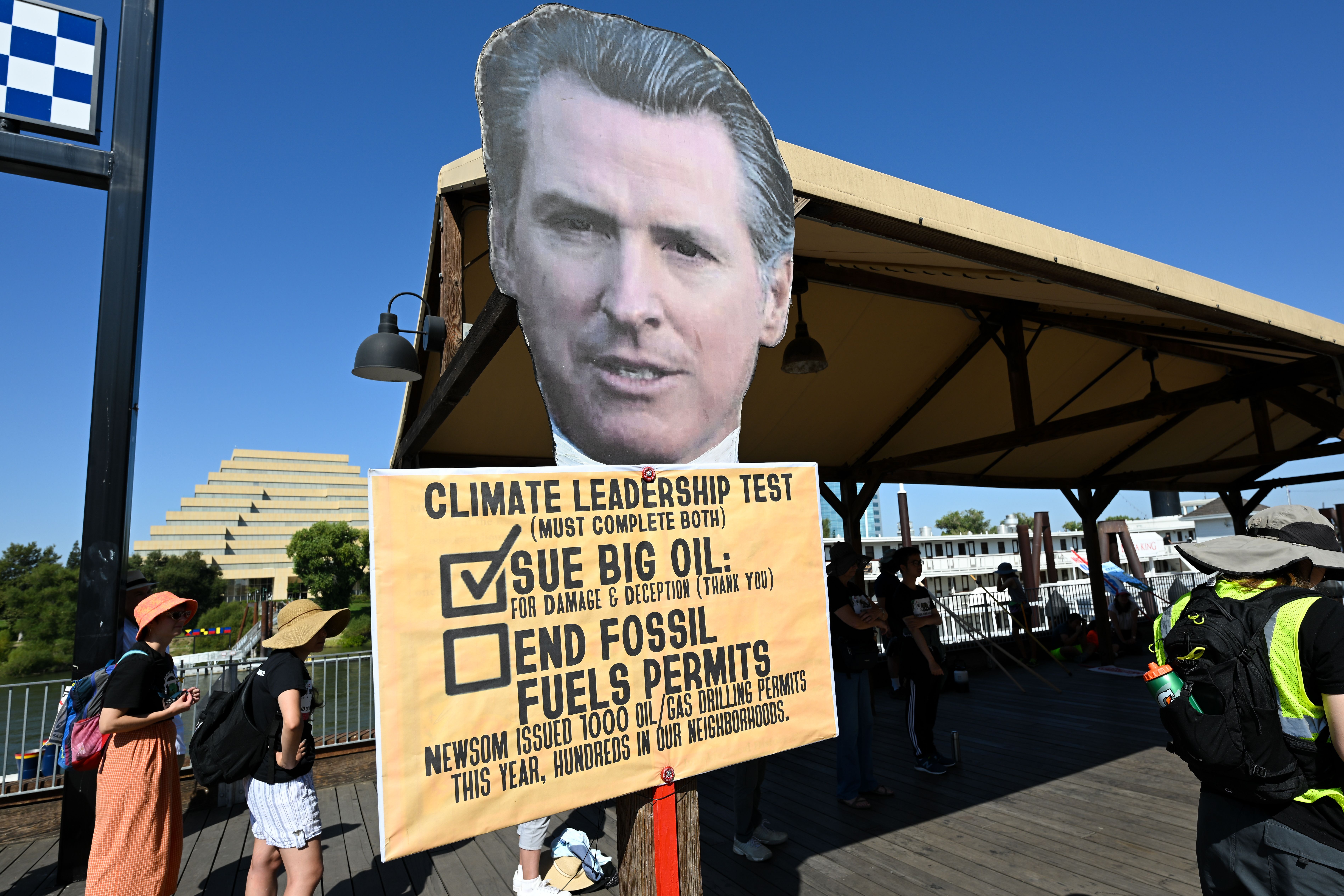  Governor Gavin Newsom's mock-up is seen as hundreds of climate change activists are gathered at Old Sacramento Waterfront near the Tower Bridge, to protest global climate change and fossil fuels, in Sacramento, California, United States on September 17, 2023. 