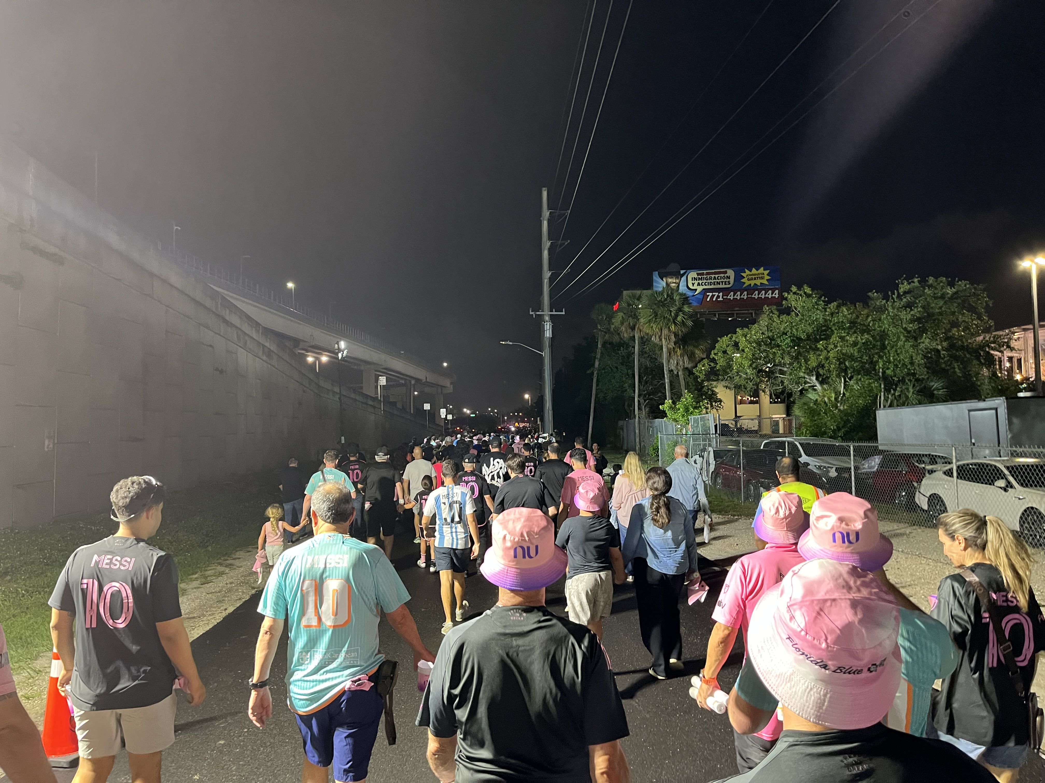 Inter Miami fans walk toward a nearby transit hub near the stadium after Saturday's match. Photo: Martin Vassolo/Axios