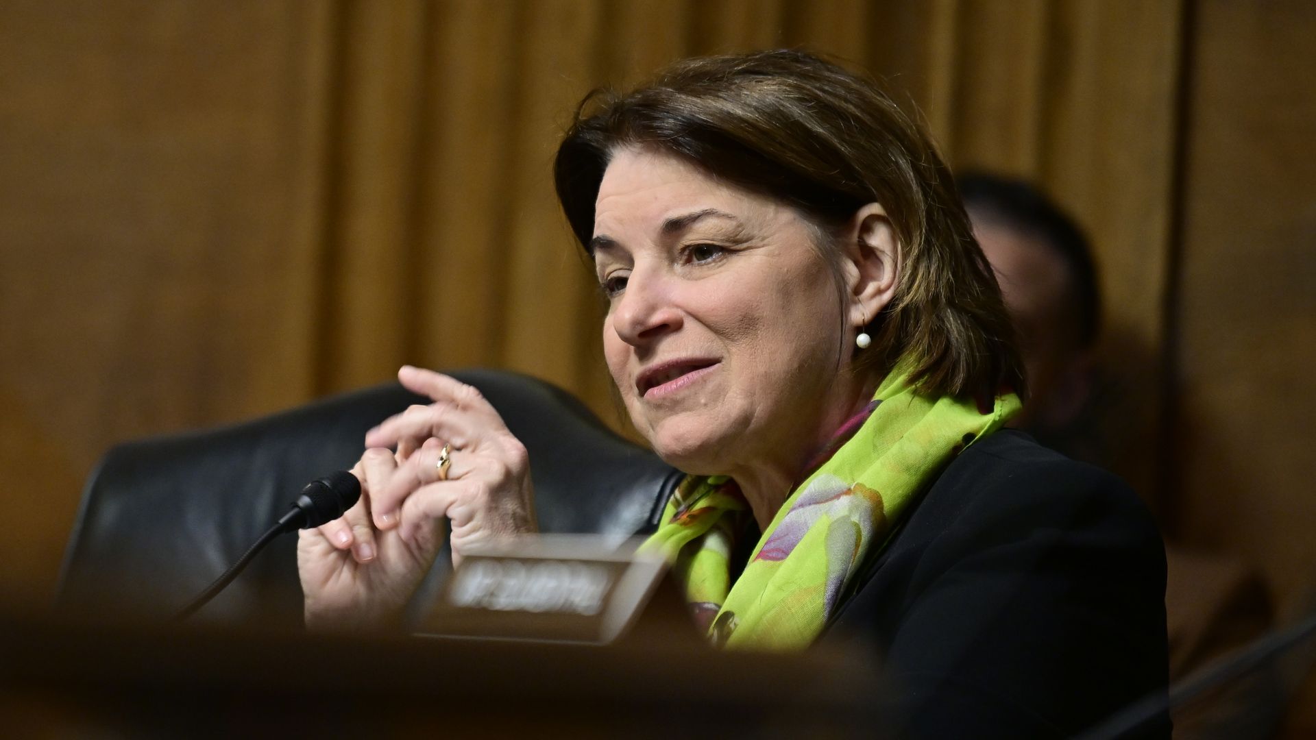 Amy Klobuchar in a green scarf