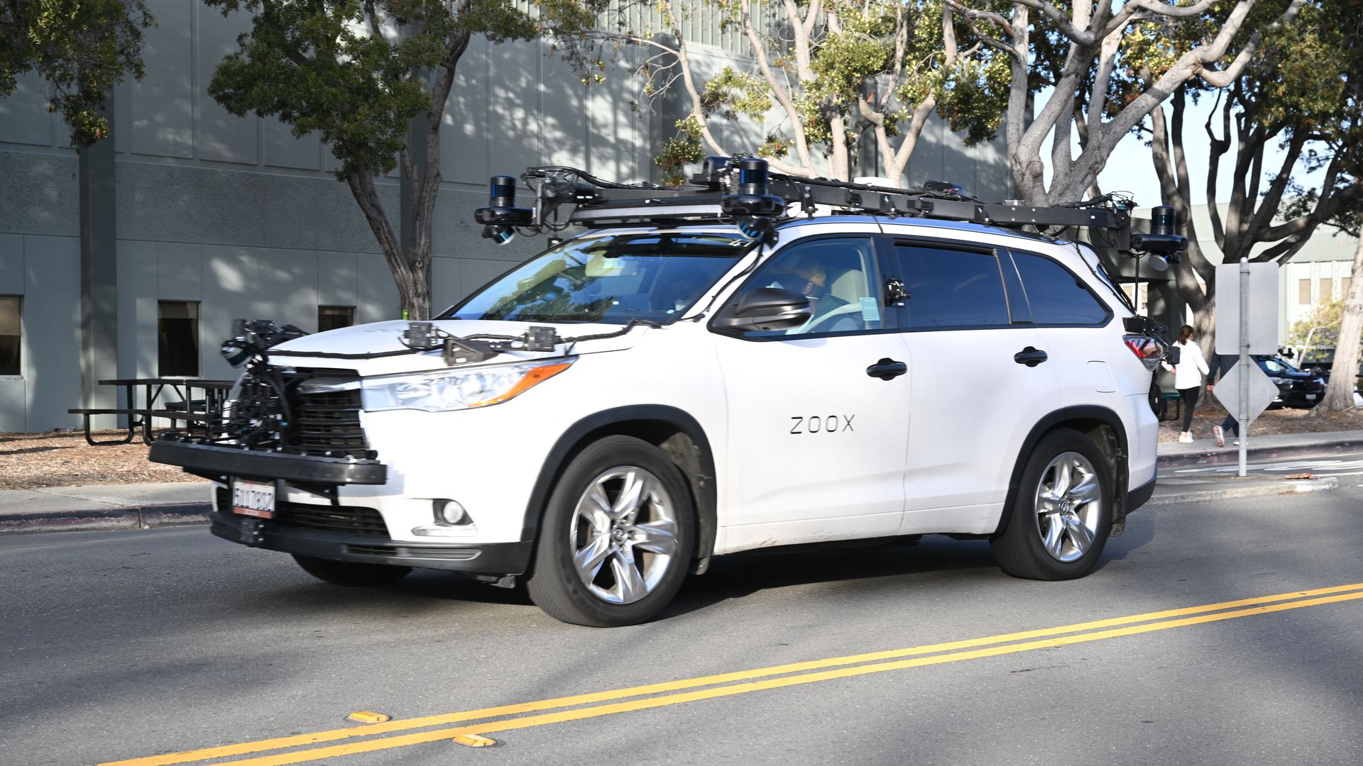 A white SUV equipped with autonomous vehicle systems