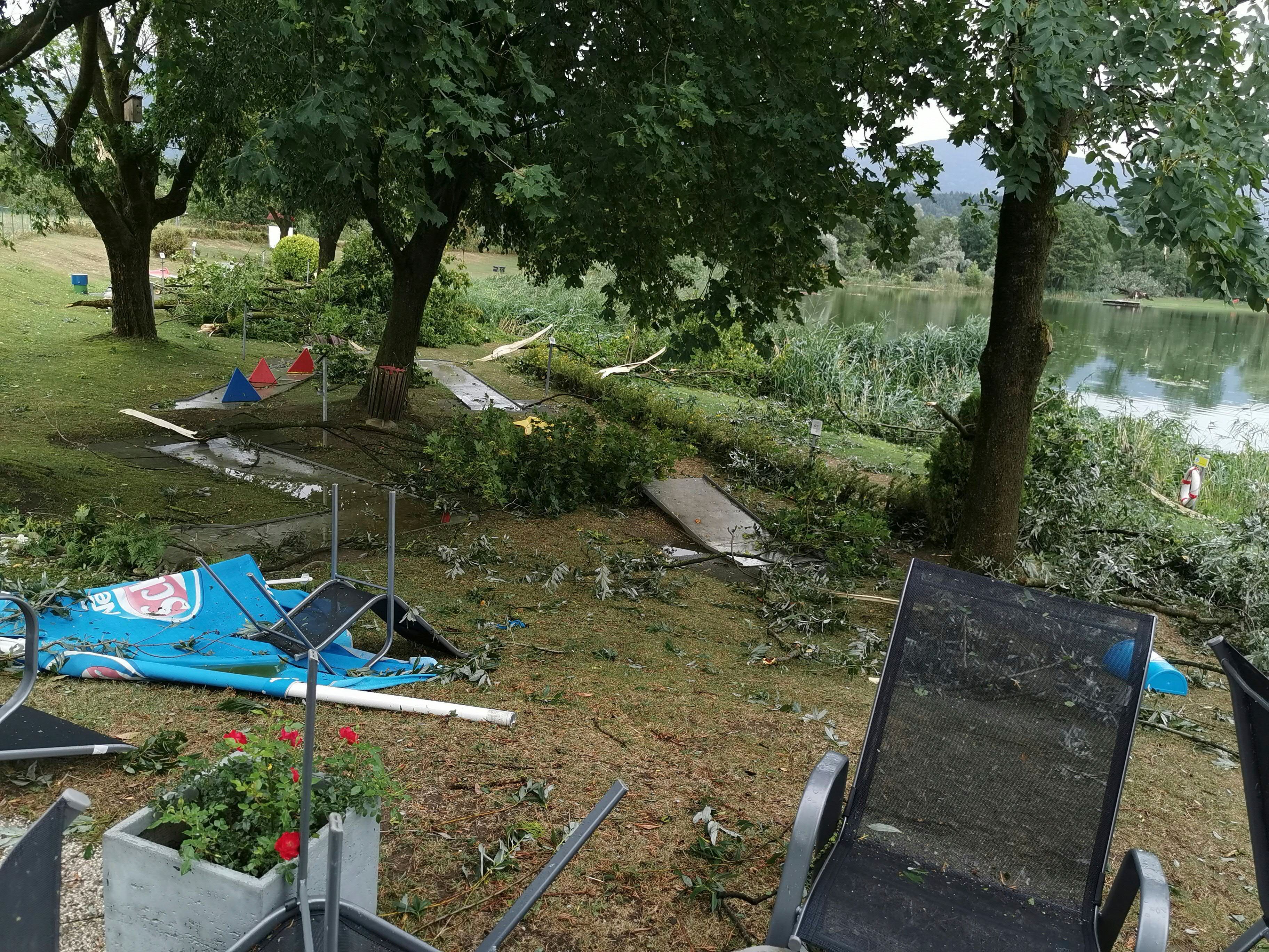  Branches and fallen trees are seen near Lake St. Andraer after a severe storm hit in Lavanttal, southern Austria, on August 18, 2022, killing two children.