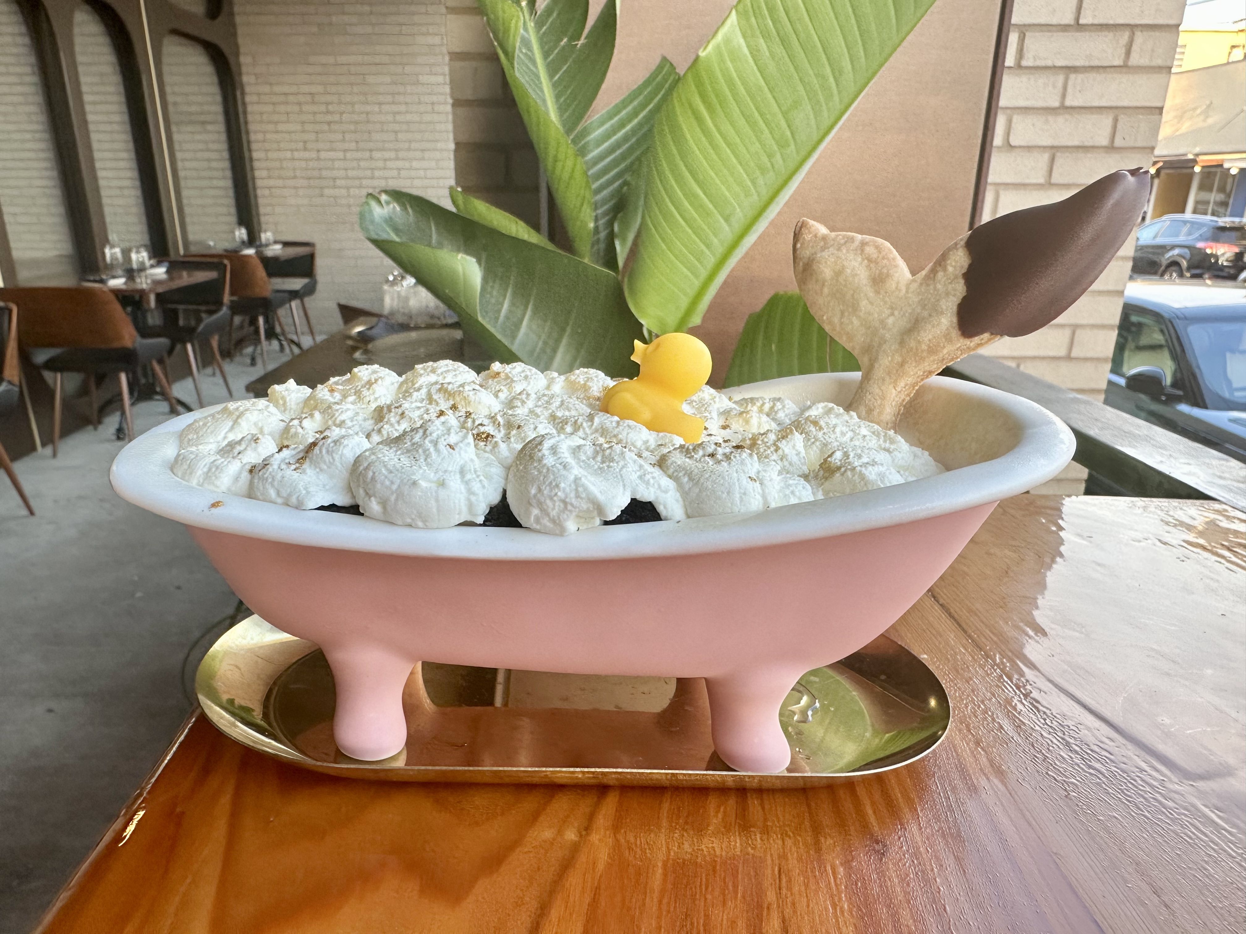 Photo shows a chocolate mousse dessert in a Barbie bathtub