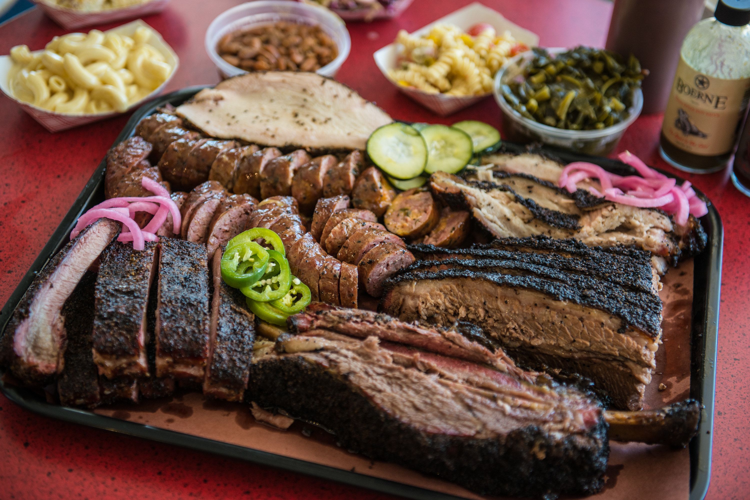platter of smoked meats and BBQ sides