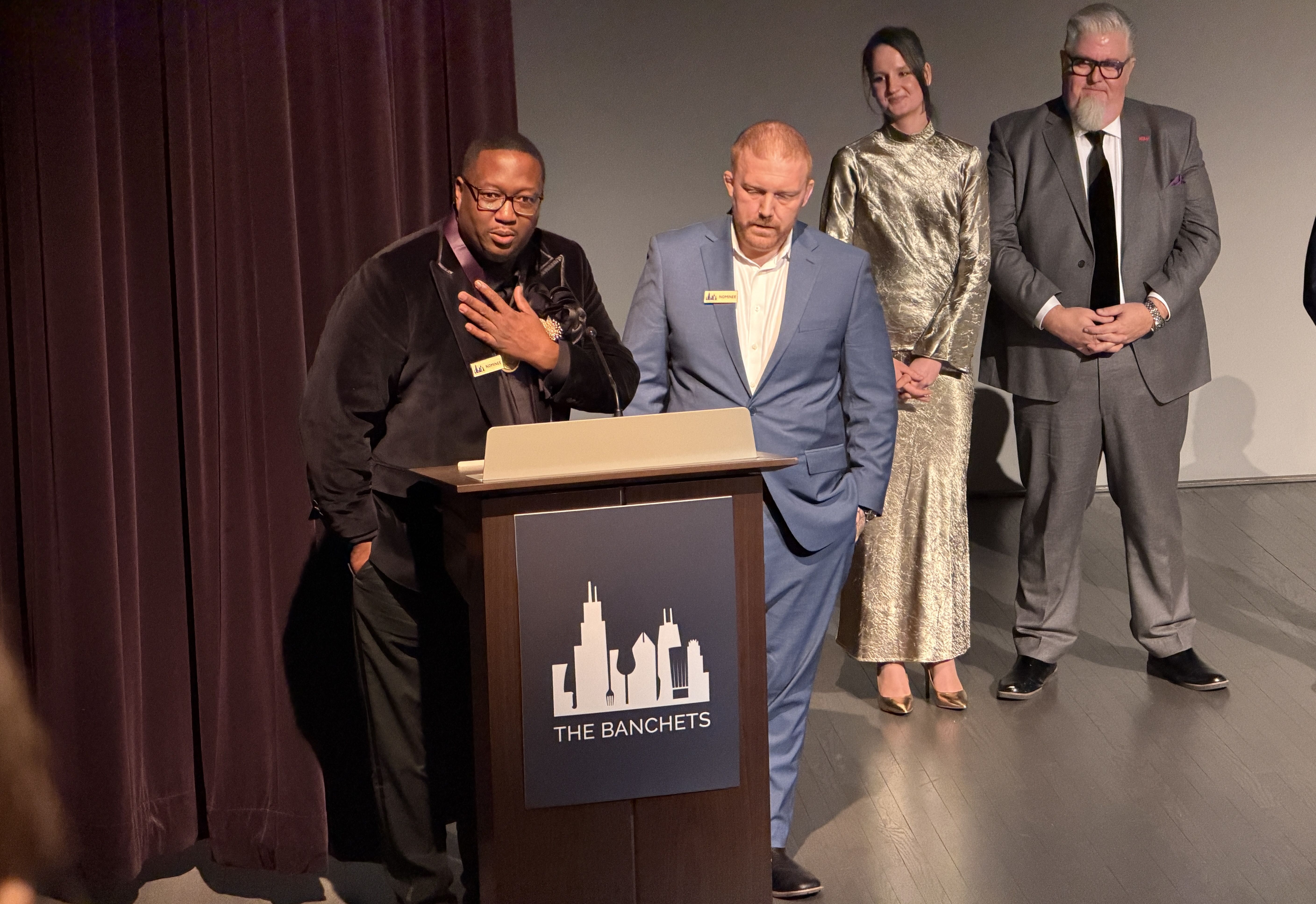 guys on stage at a podium