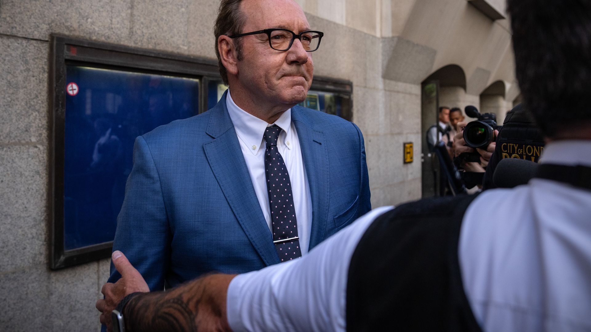 Actor Kevin Spacey leaves a court room.