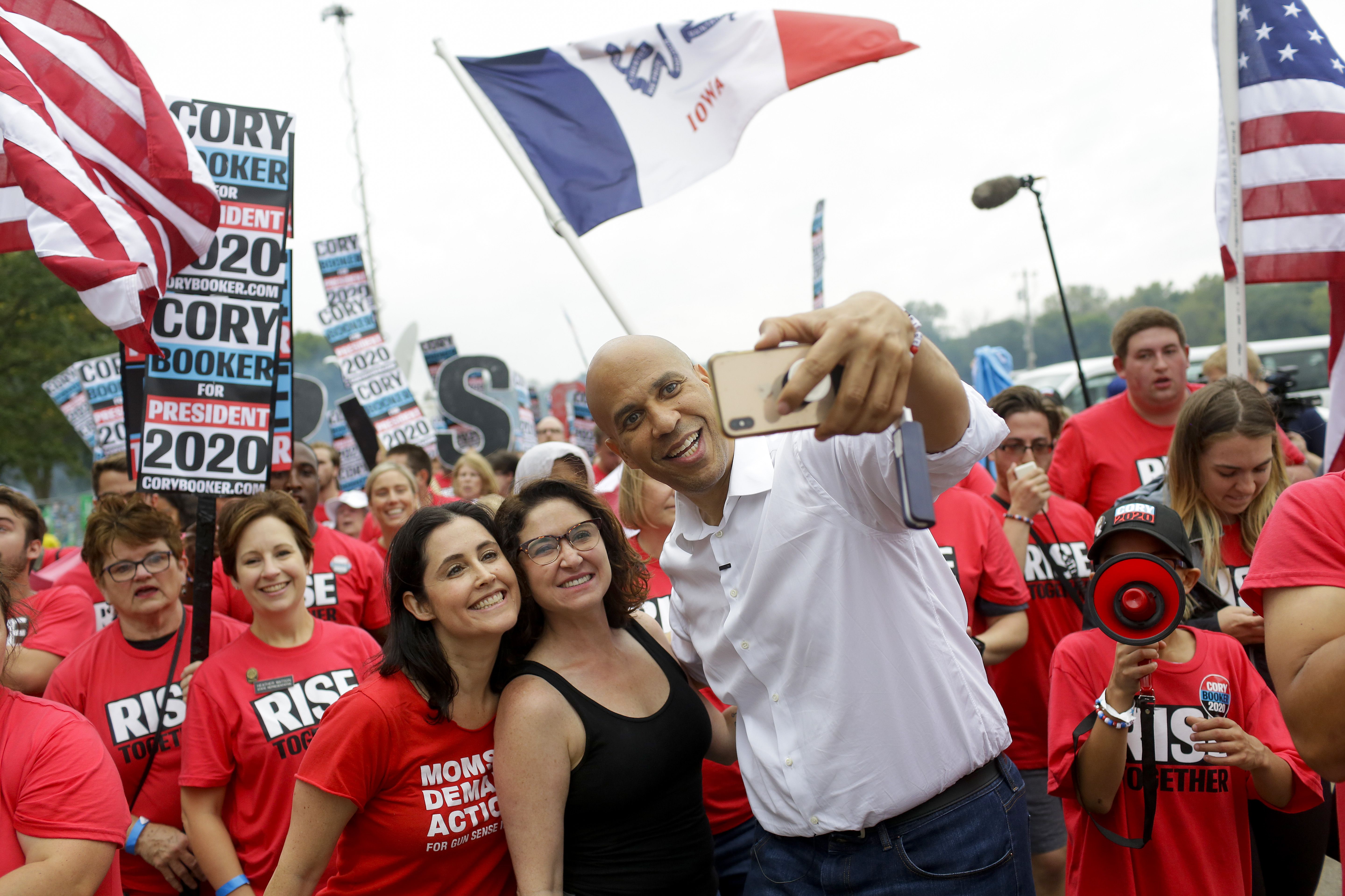 Democratic presidential candidate, Sen. Cory Booker (D-NJ) takes a selfie during the Democratic Polk County Steak Fry on September 21, 2019 in Des Moines, Iowa.