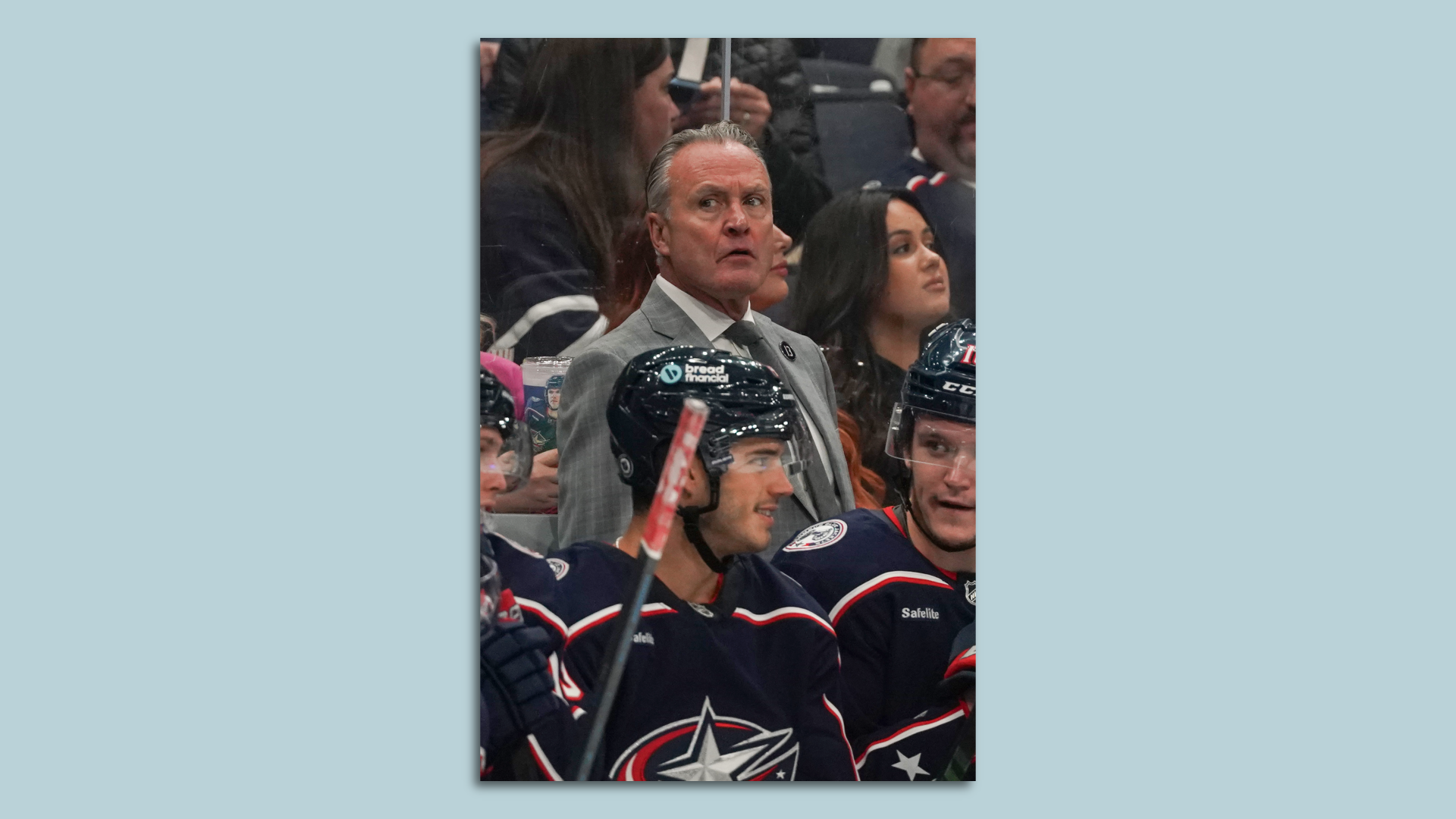 Blue Jackets head coach Dean Evason looks on from the hockey bench. 