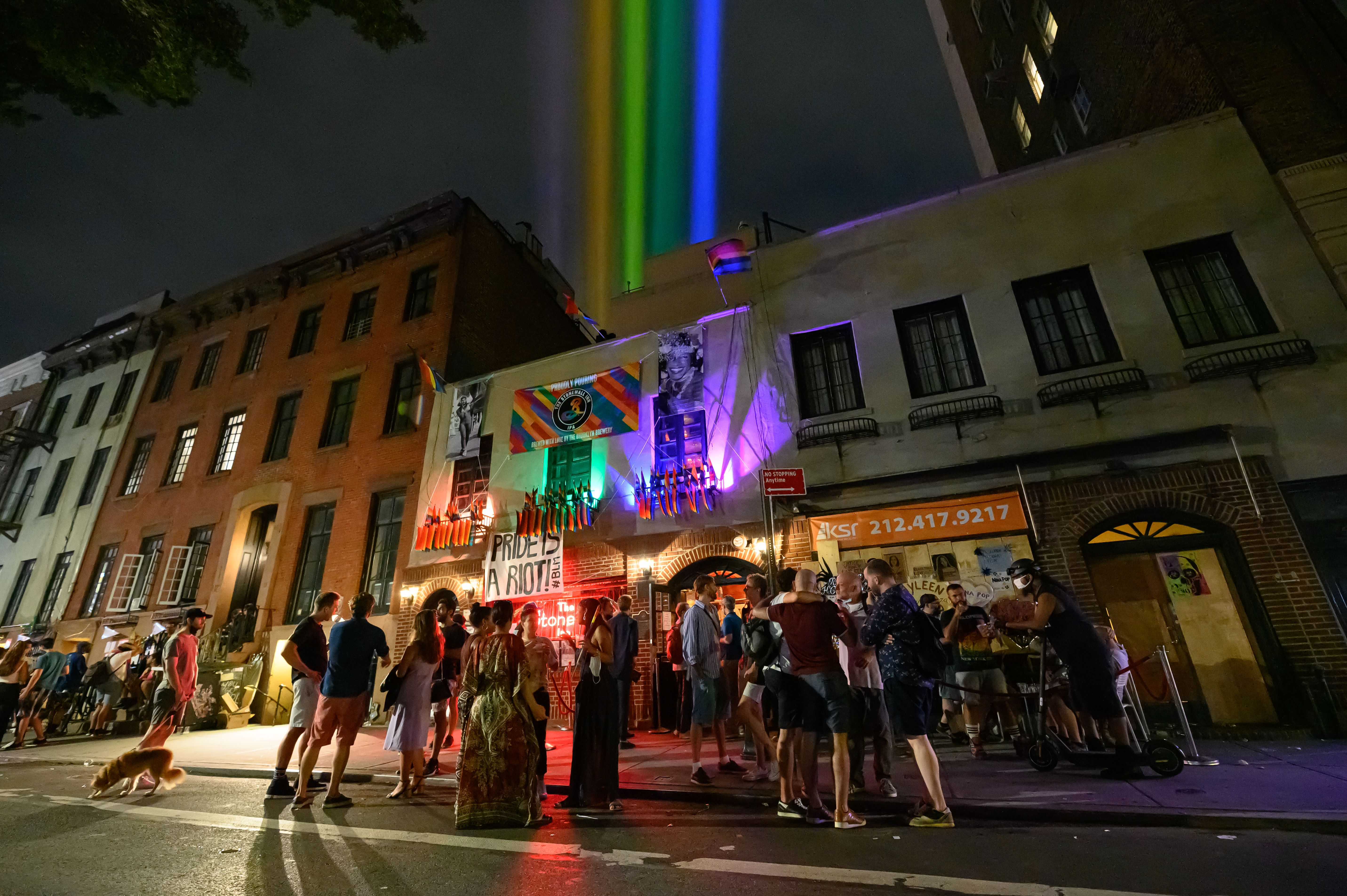 Rainbow colored lights projected outside The Stonewall Inn on June 27