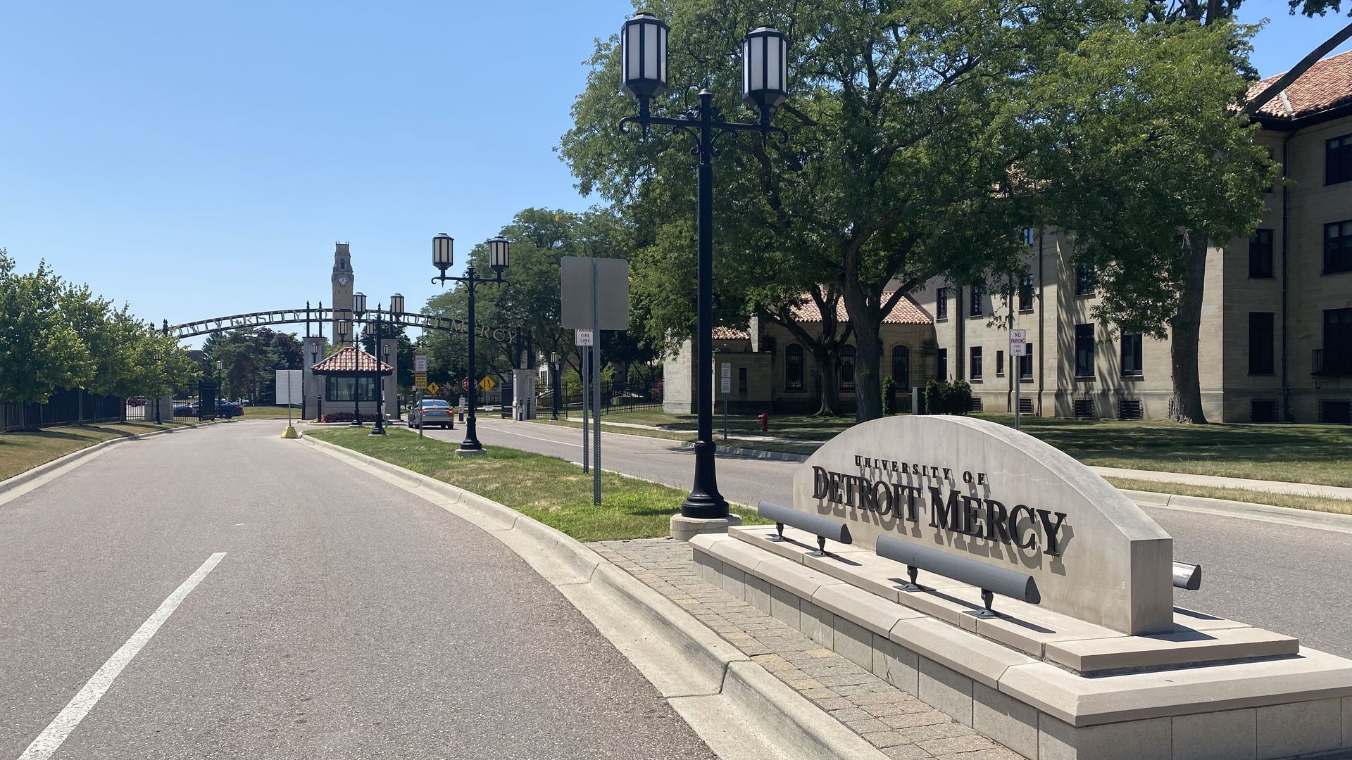 University of Detroit Mercy sign leading to the gated entrance to the campus. 
