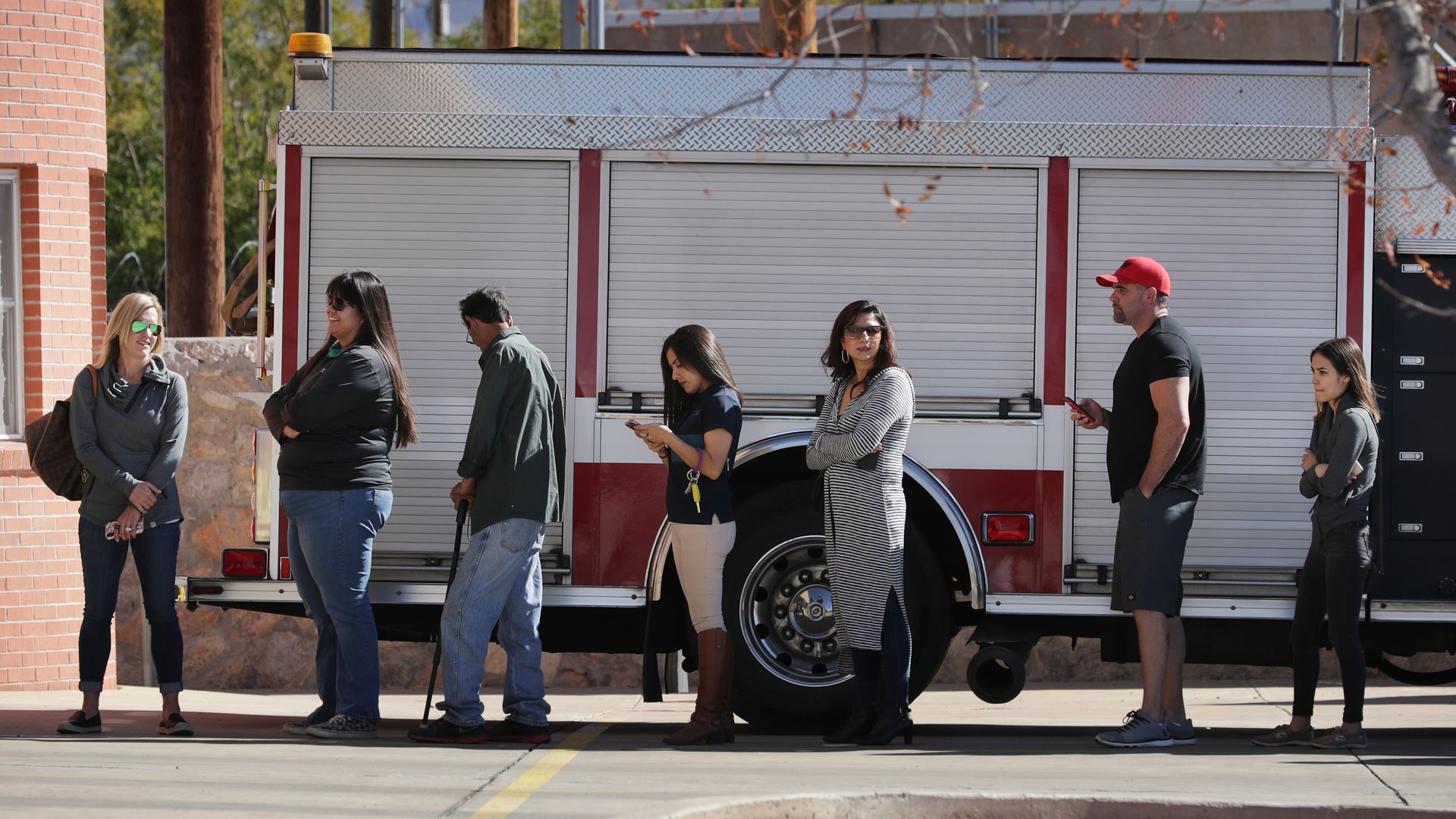 Voters are seen lining up outside a Texas fire station during an election in 2018.
