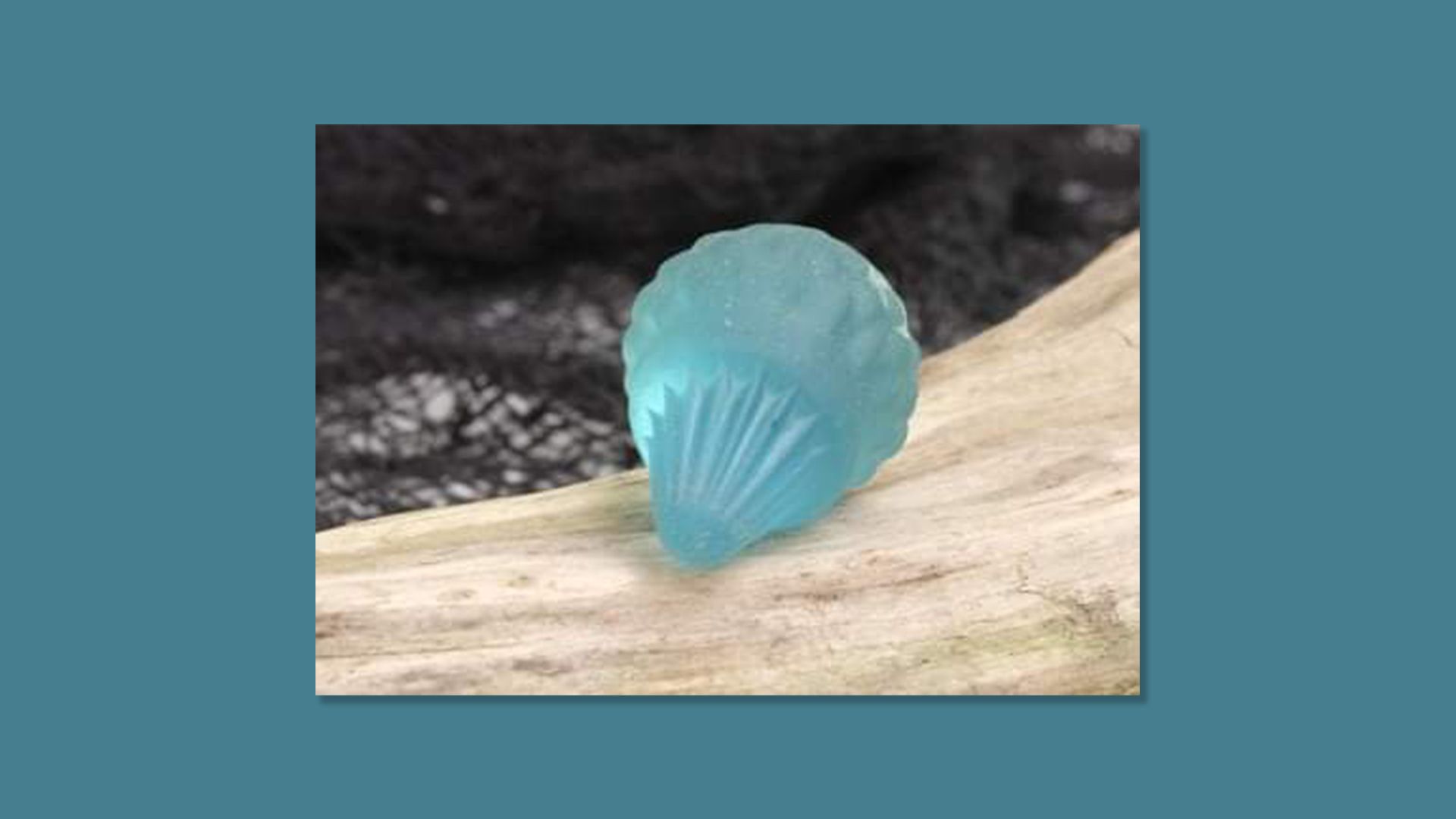 A turquoise sea glass bottle stopper.