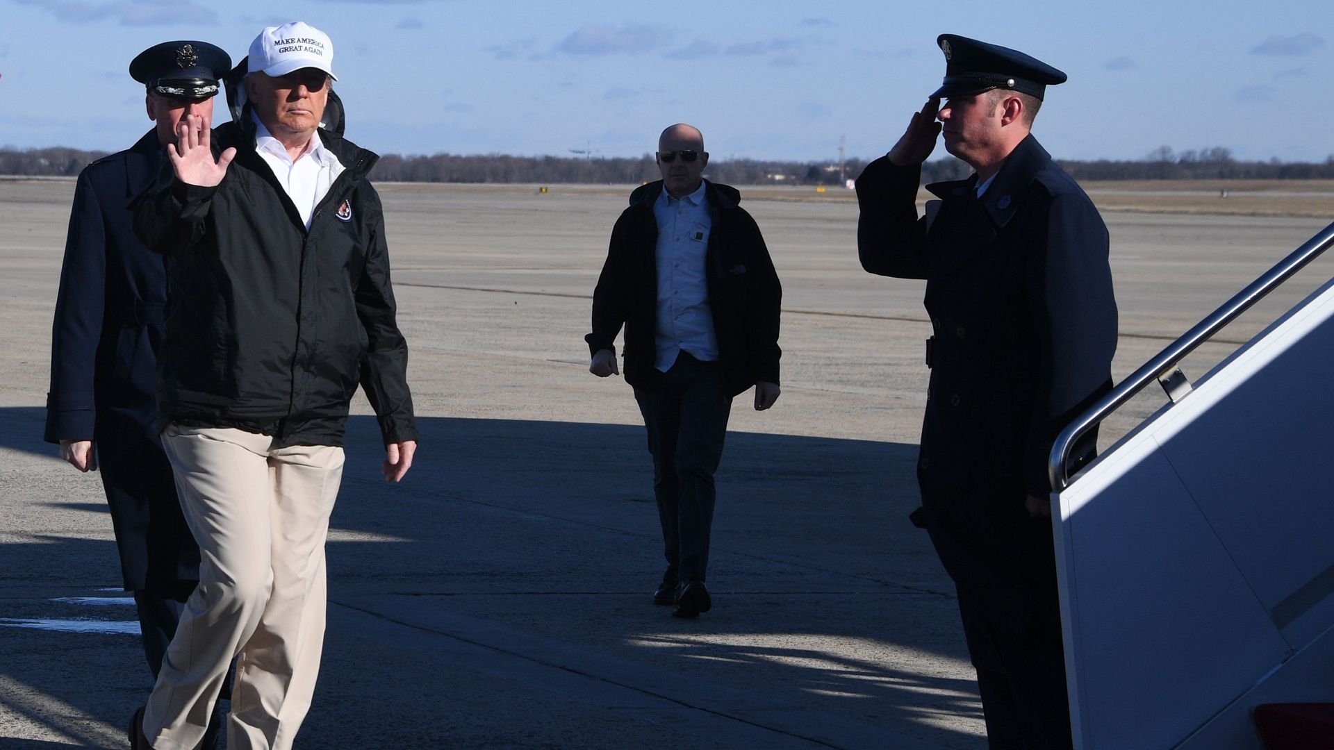 Trump waving as he steps onto Air Force One