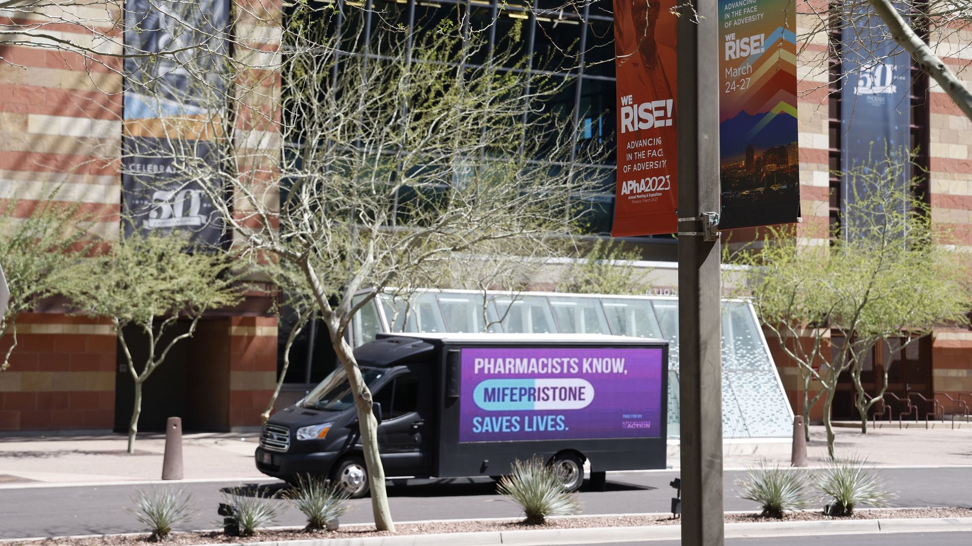 A truck that says, "Pharmacists know mifepristone saves lives," 