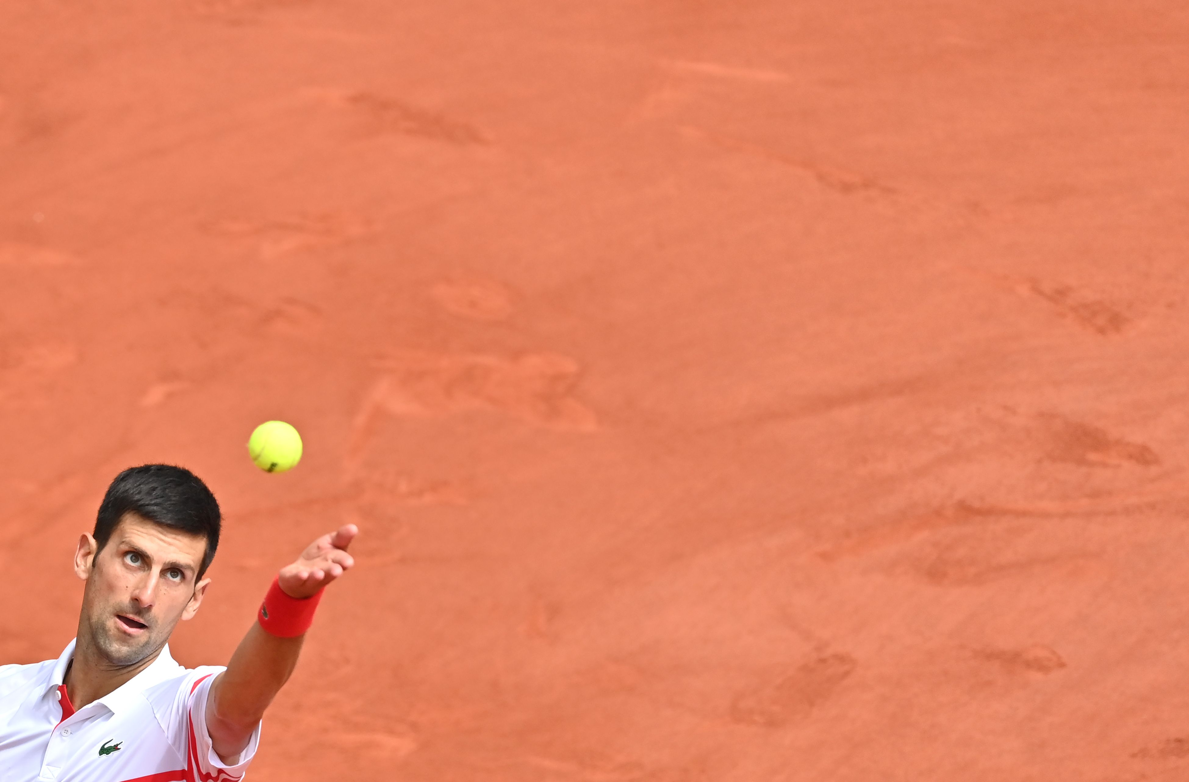 novak djokovic lines up a serve