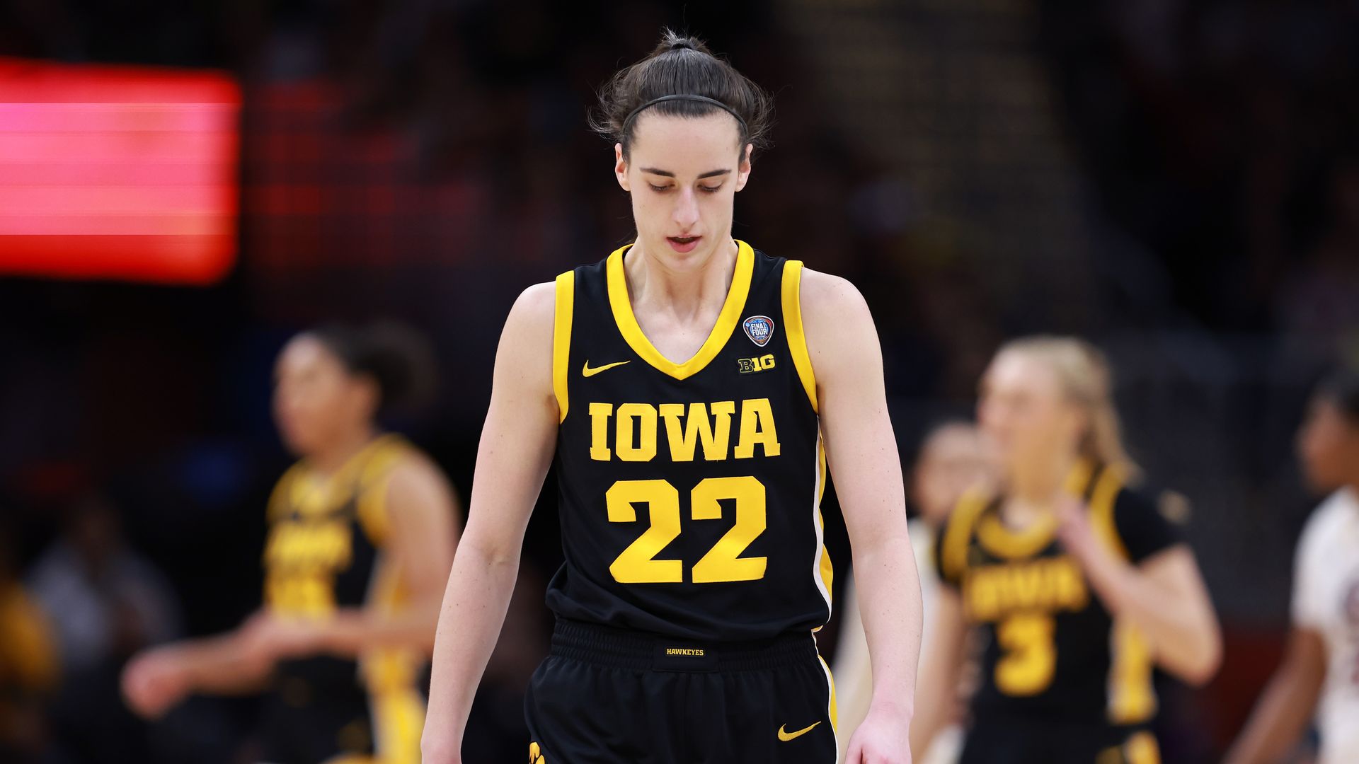 Caitlin Clark of Iowa in a black basketball uniform