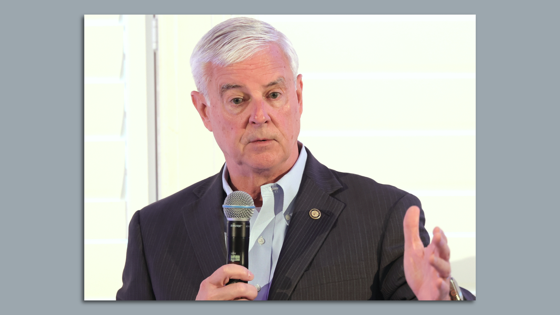 A photo of Congressman Steve Womack speaking into a microphone.