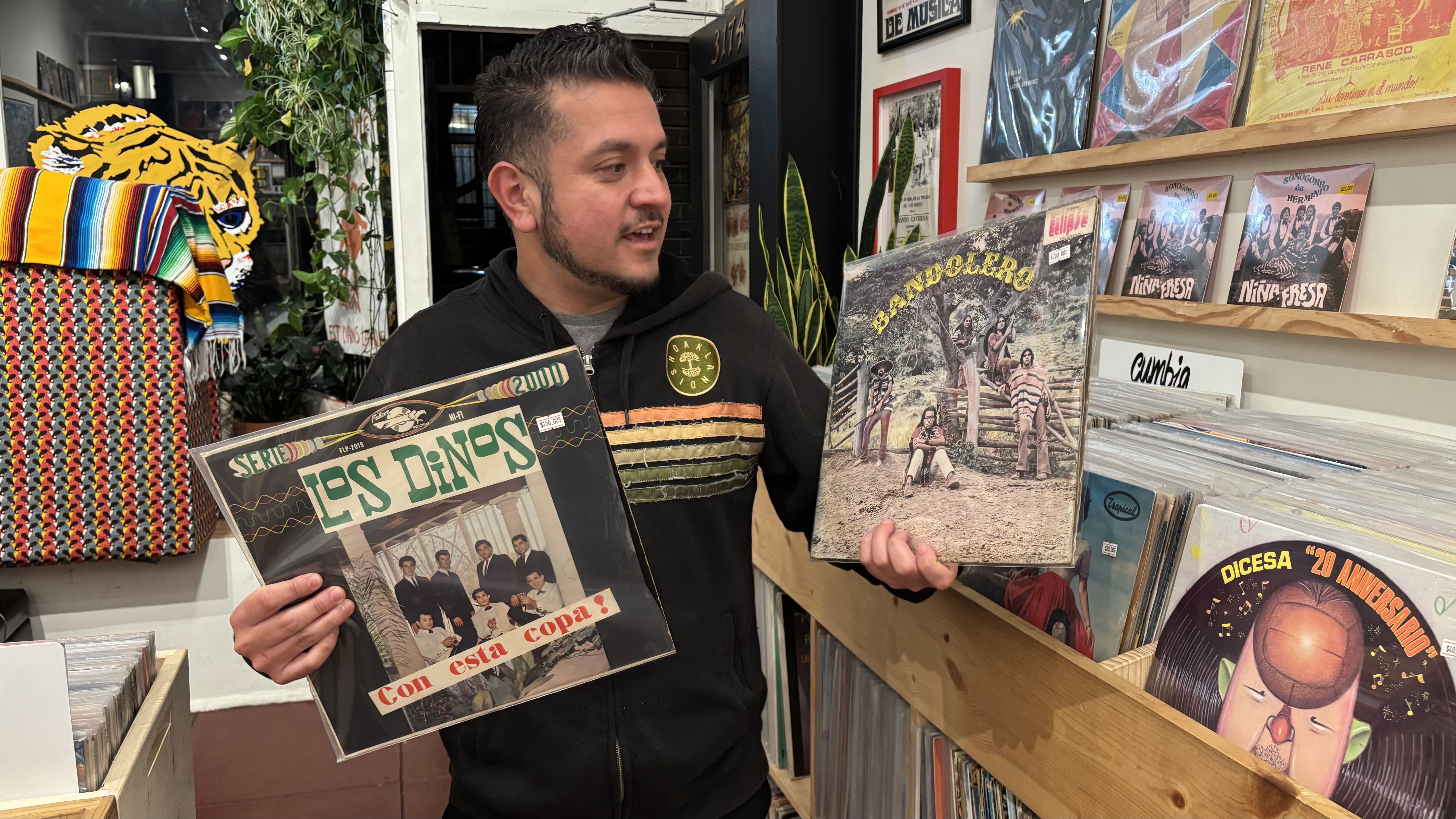 Jesus holds a rare record of Los Dinos, the band Selena Quintanilla's father started. 