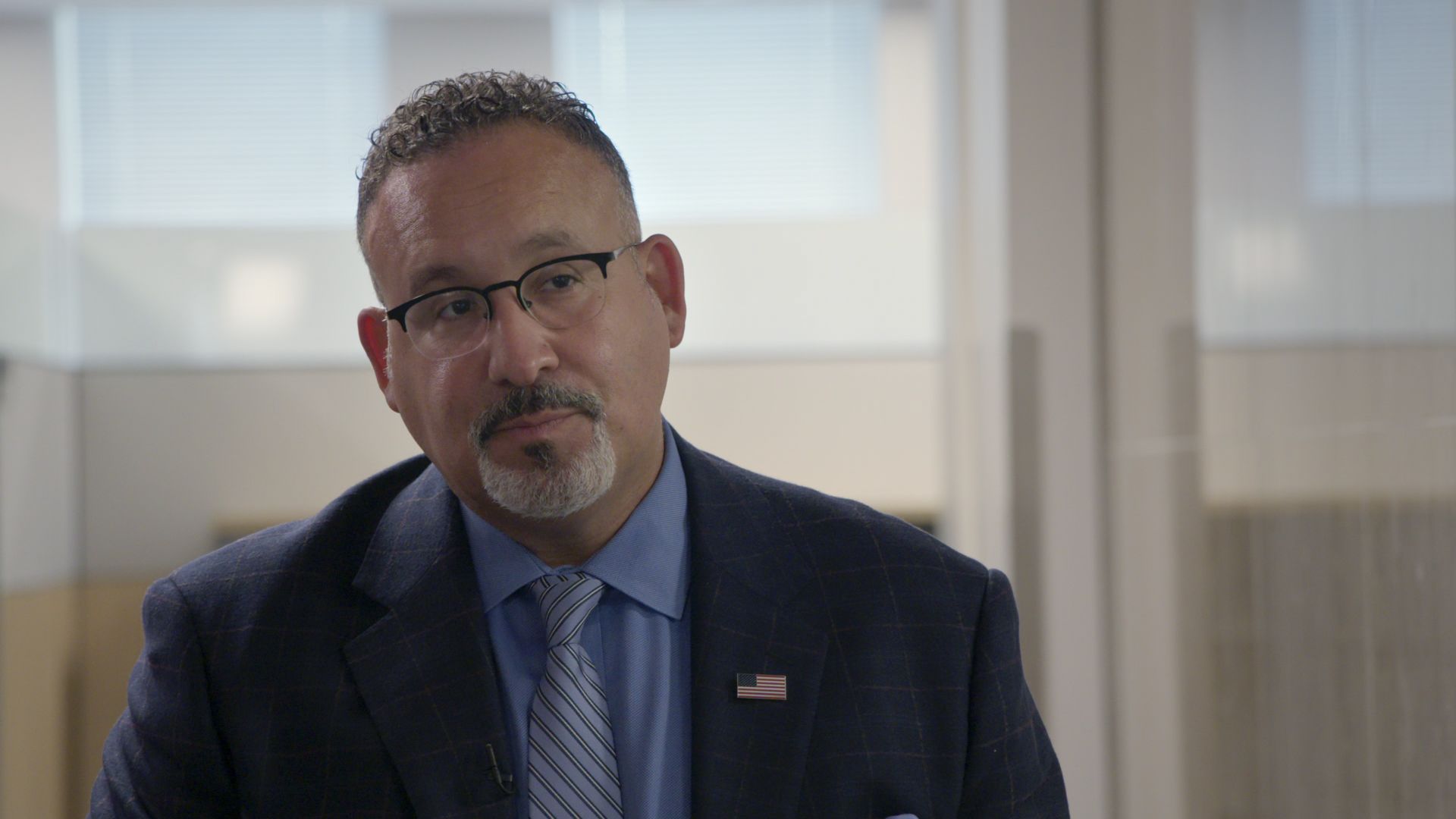 Education Secretary Miguel Cardona is seen during an interview with 