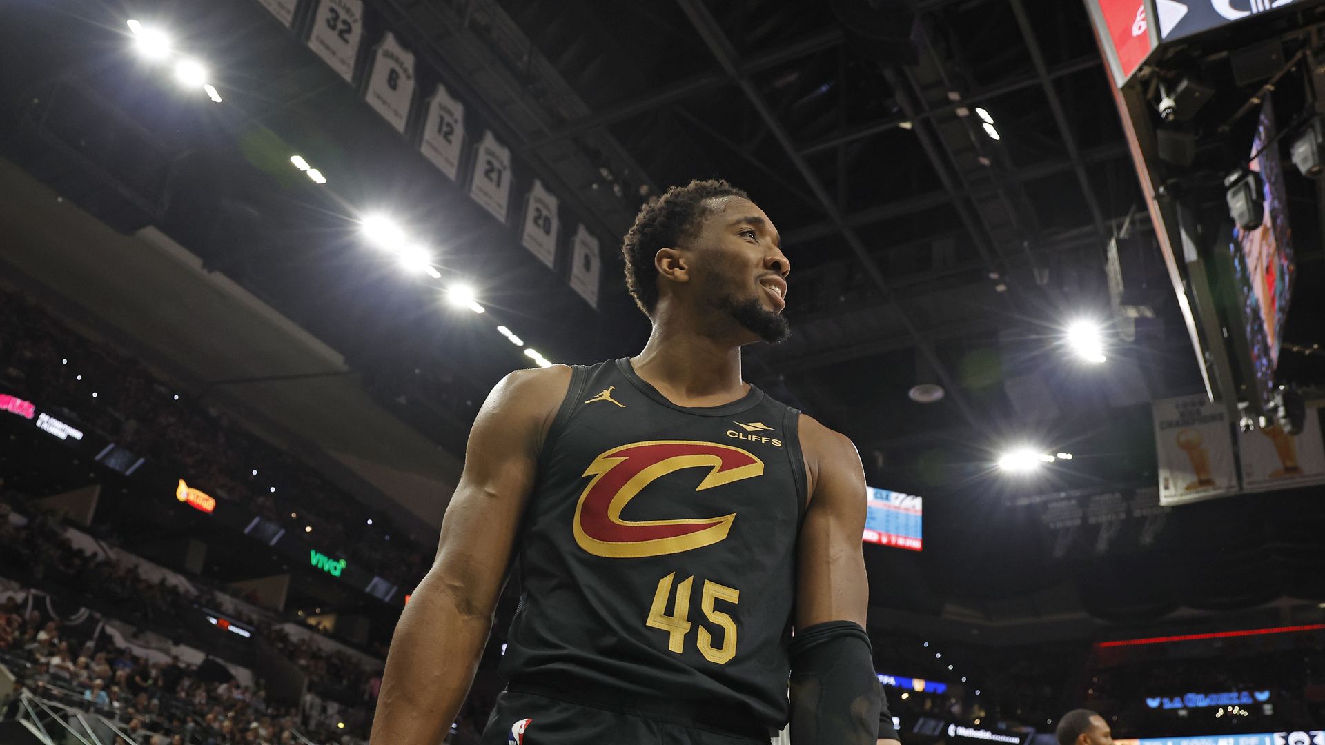 Photo of NBA's Donovan Mitchell in black Cavs jersey with C on it