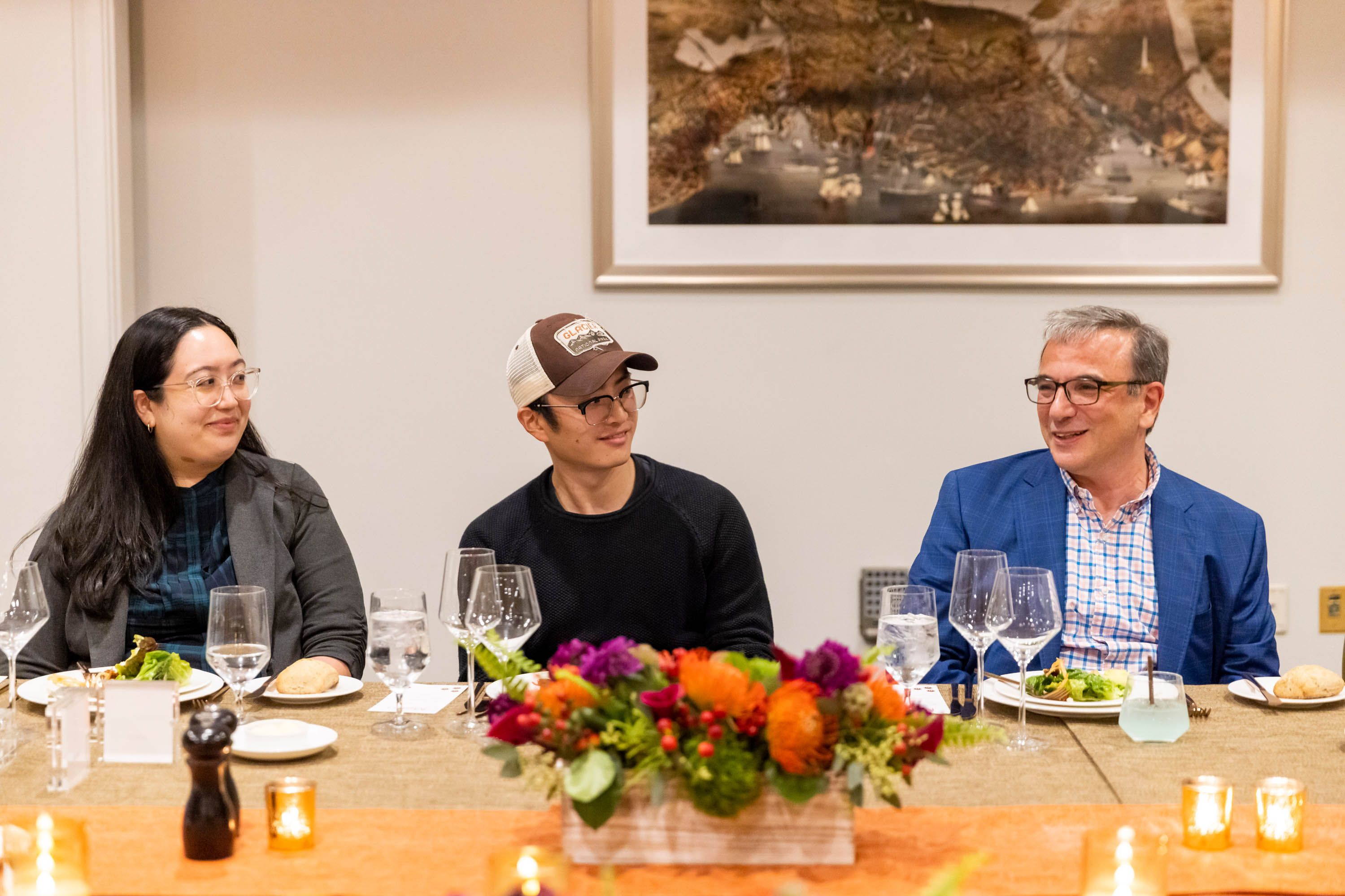 Joe Zhou, Founder & CEO of Mana Interactive Inc., sits at the Axios table between Jessica Morris, left, and Aaron Pressman.