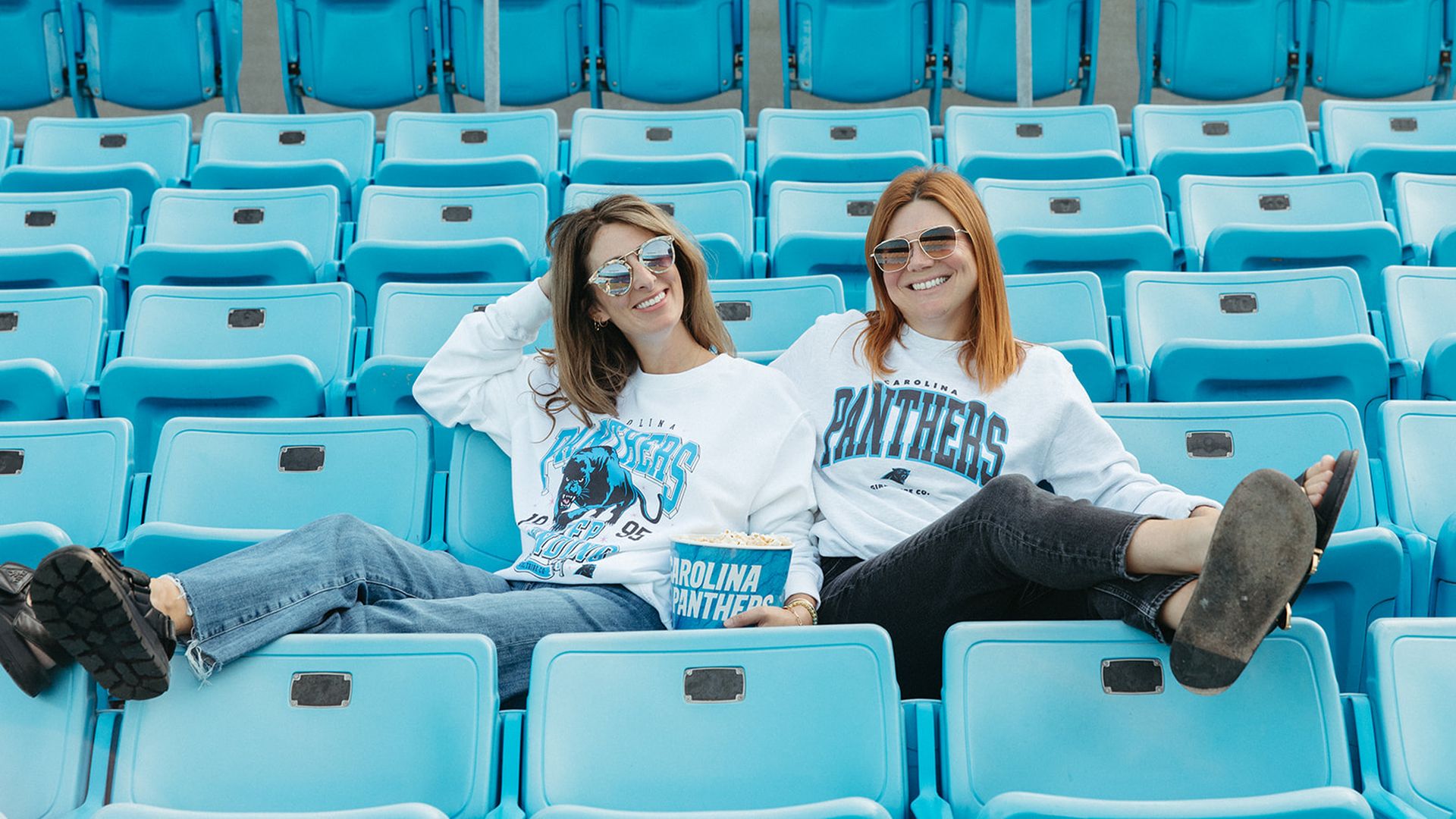 Girl Tribe co-founders wear the new collection at Bank of America Stadium.