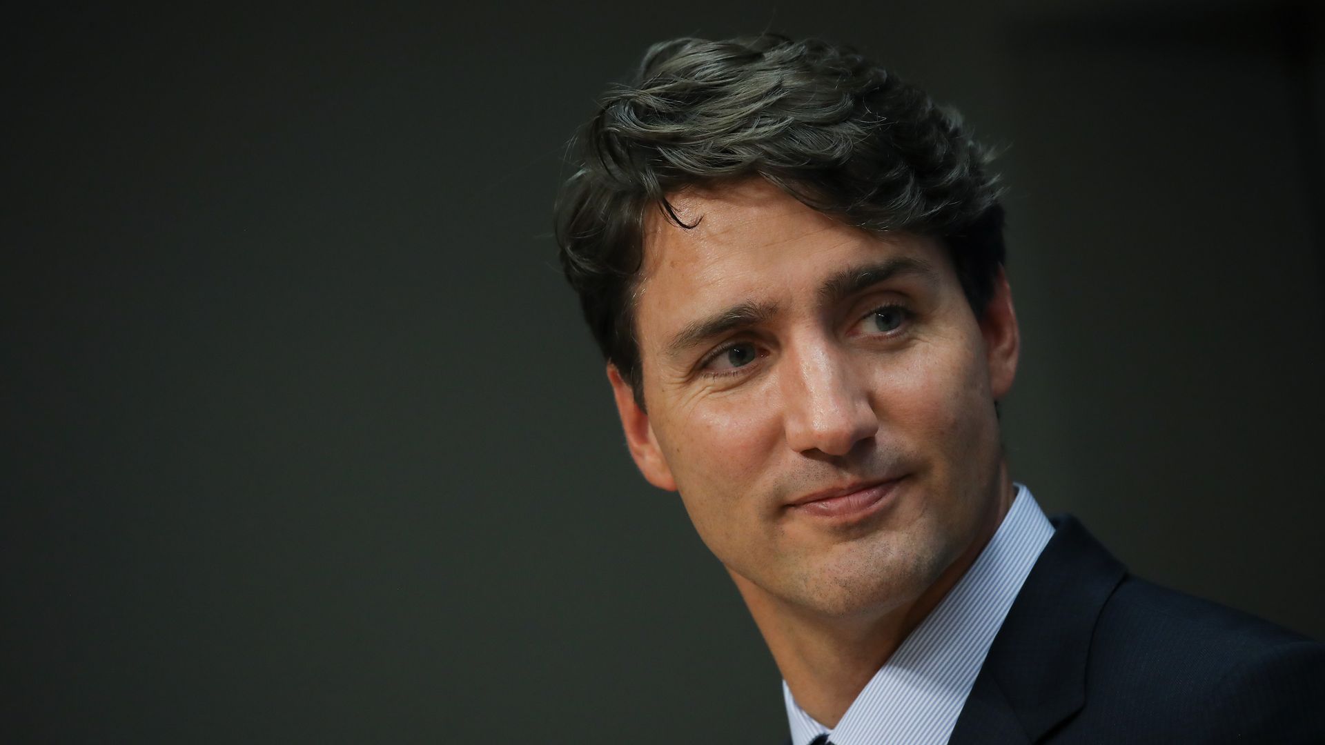 In this image, Canadian Prime Minister Justin Trudeau looks to the right. 