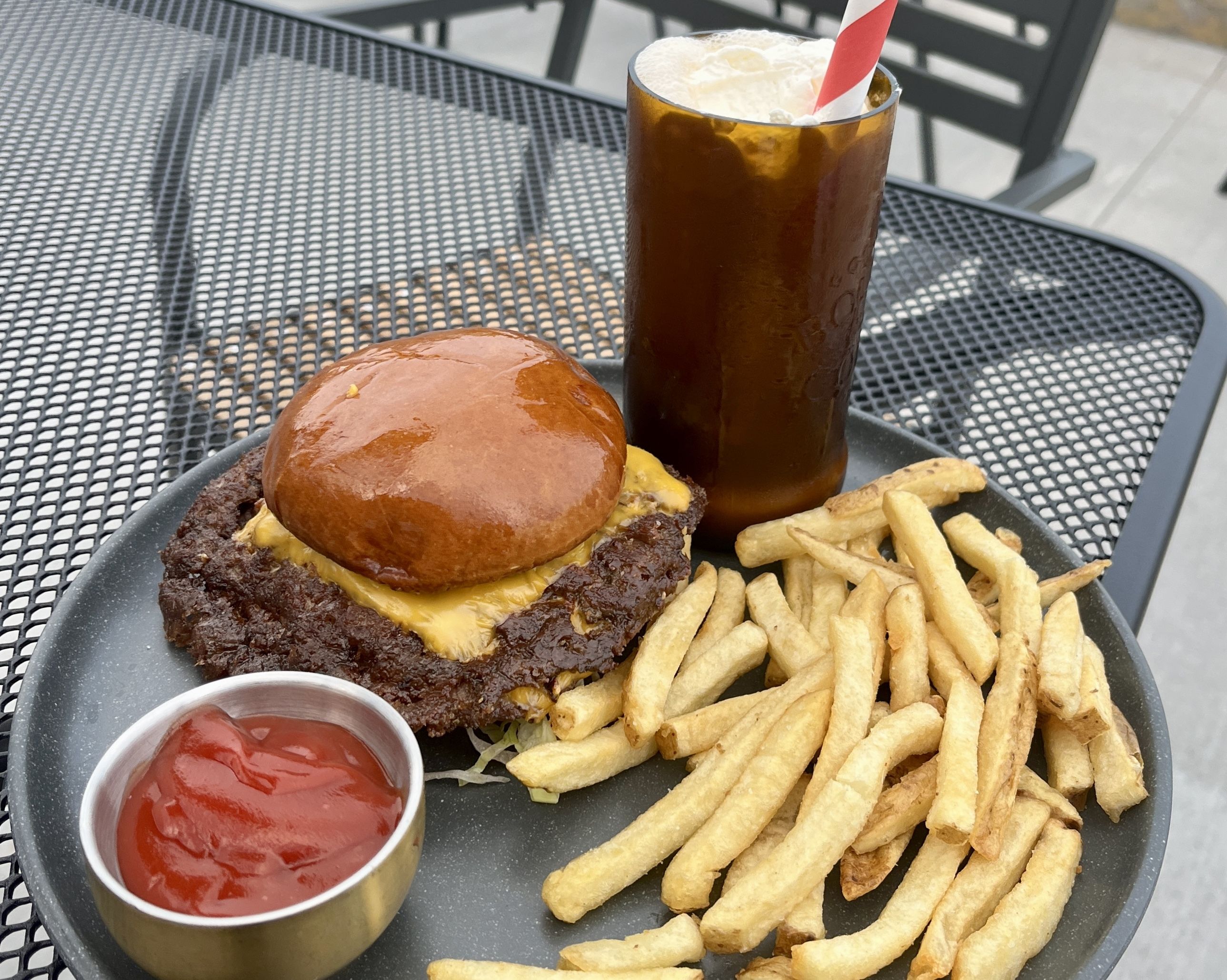 Photo of a burger and fries on a plate 