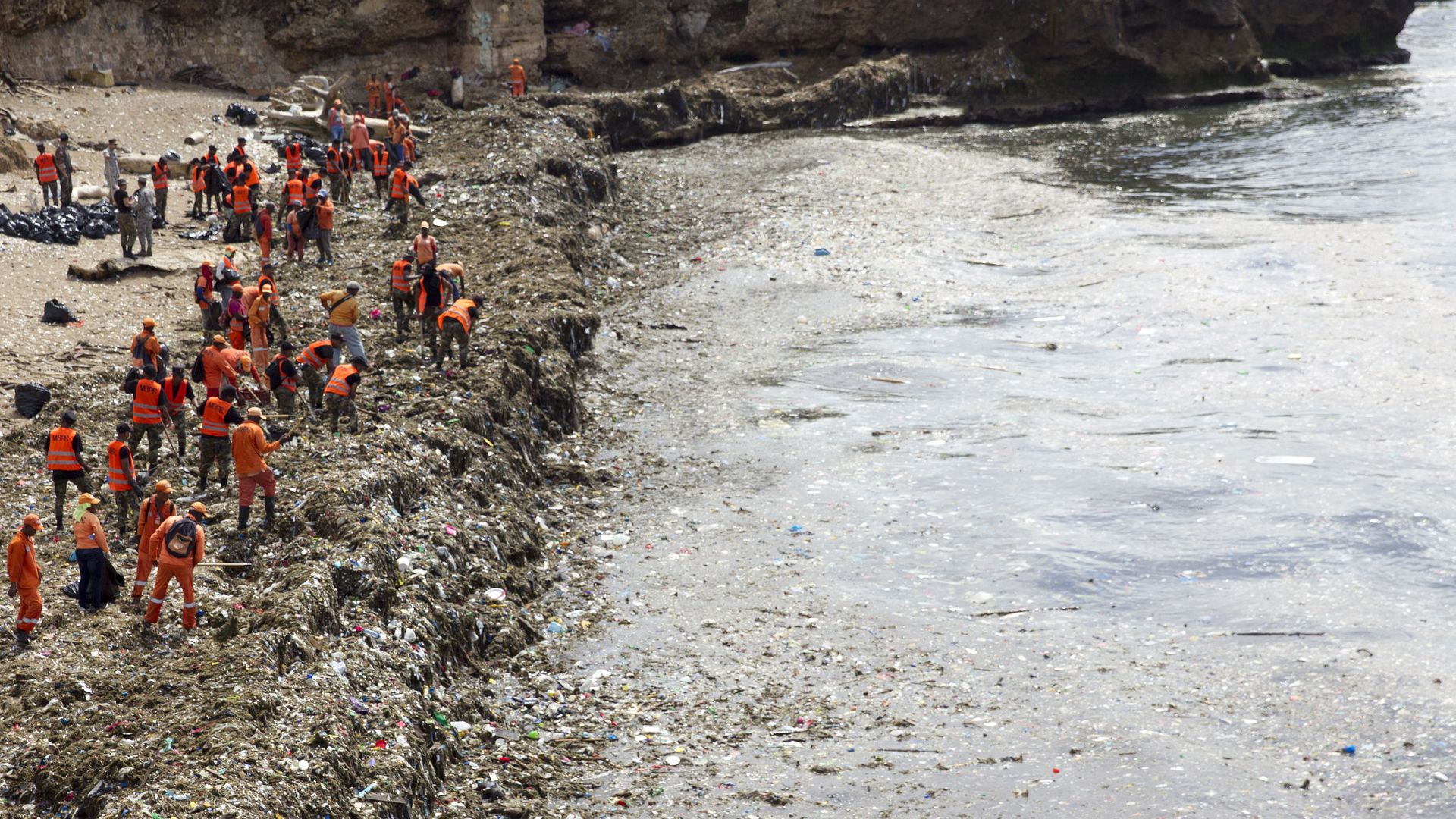 Government workers collecting garbage from a beach in Santo Domingo, Dominican Republic, last week. Photo: Erika Santelices/AFP/Getty Images