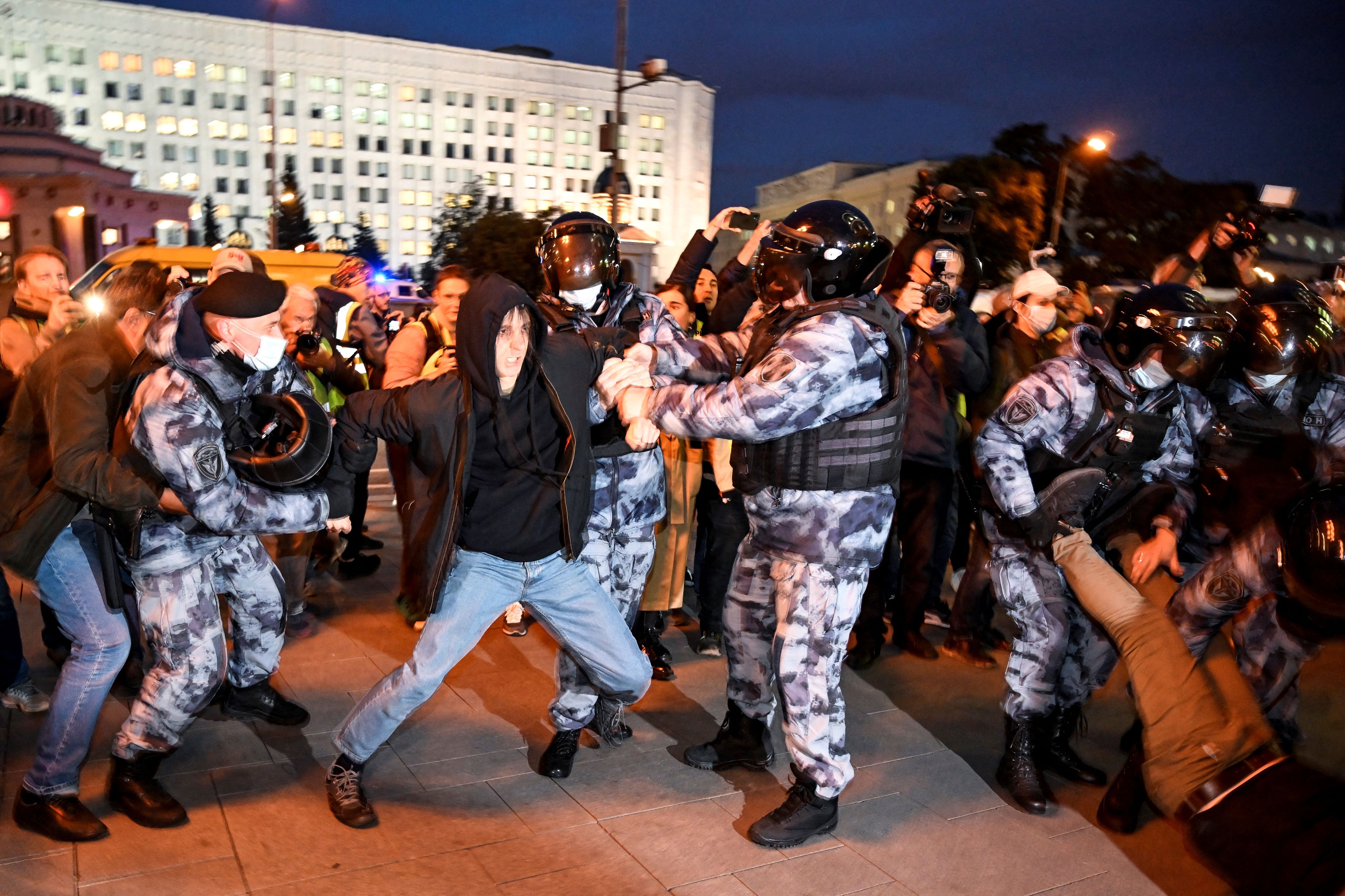 Police officers detaining a person in Moscow on Sept. 21. 