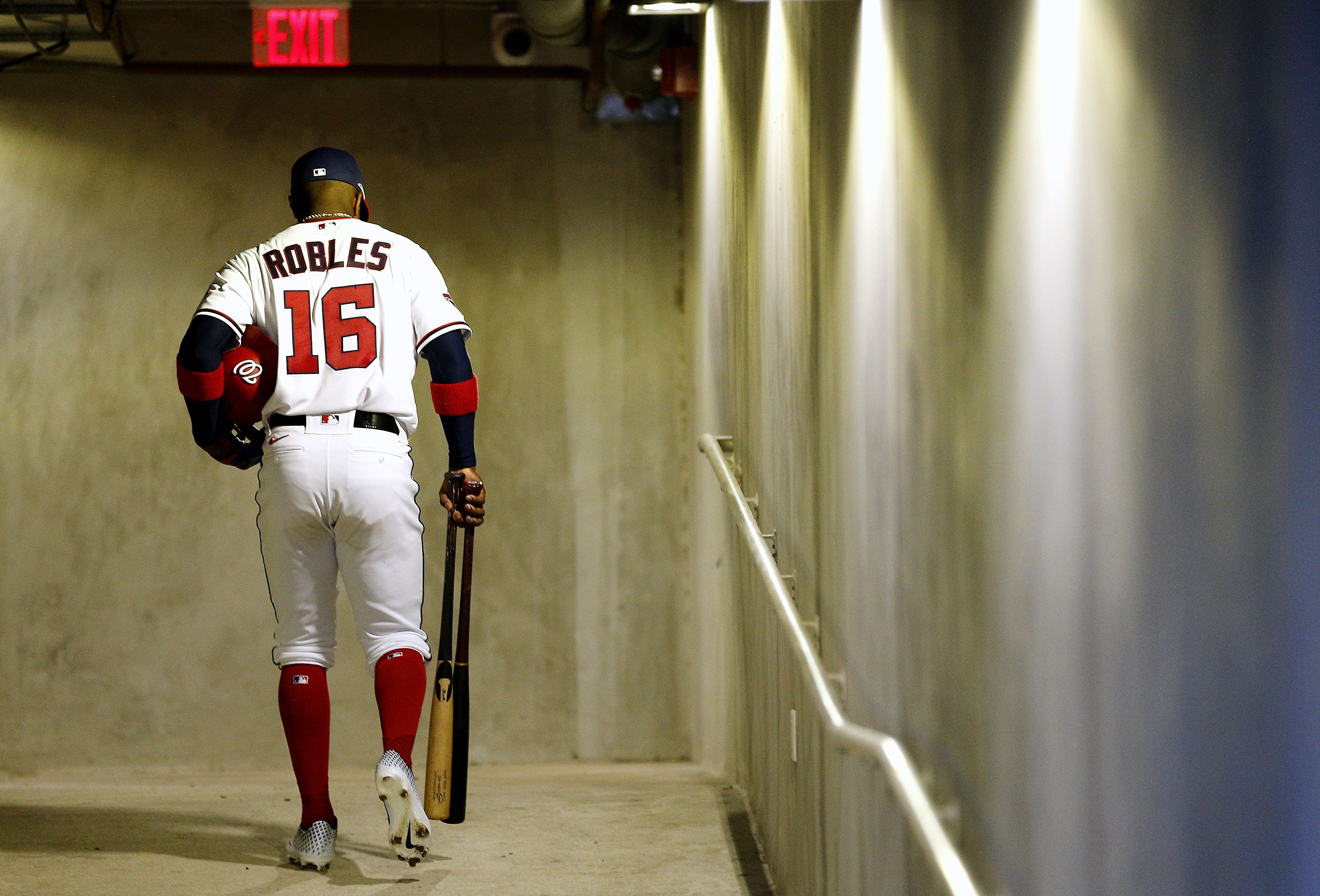 Baseball player walking off the field