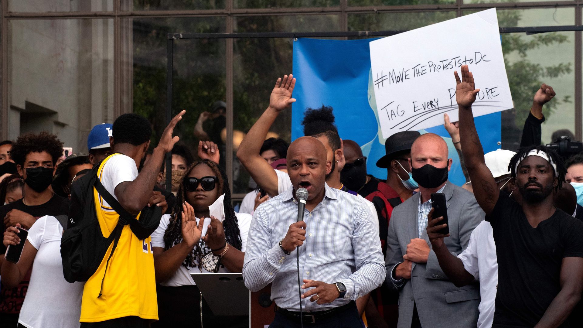 A photo of Mayor Michael Hancock speaking on a stage at a Black Lives Matter rally