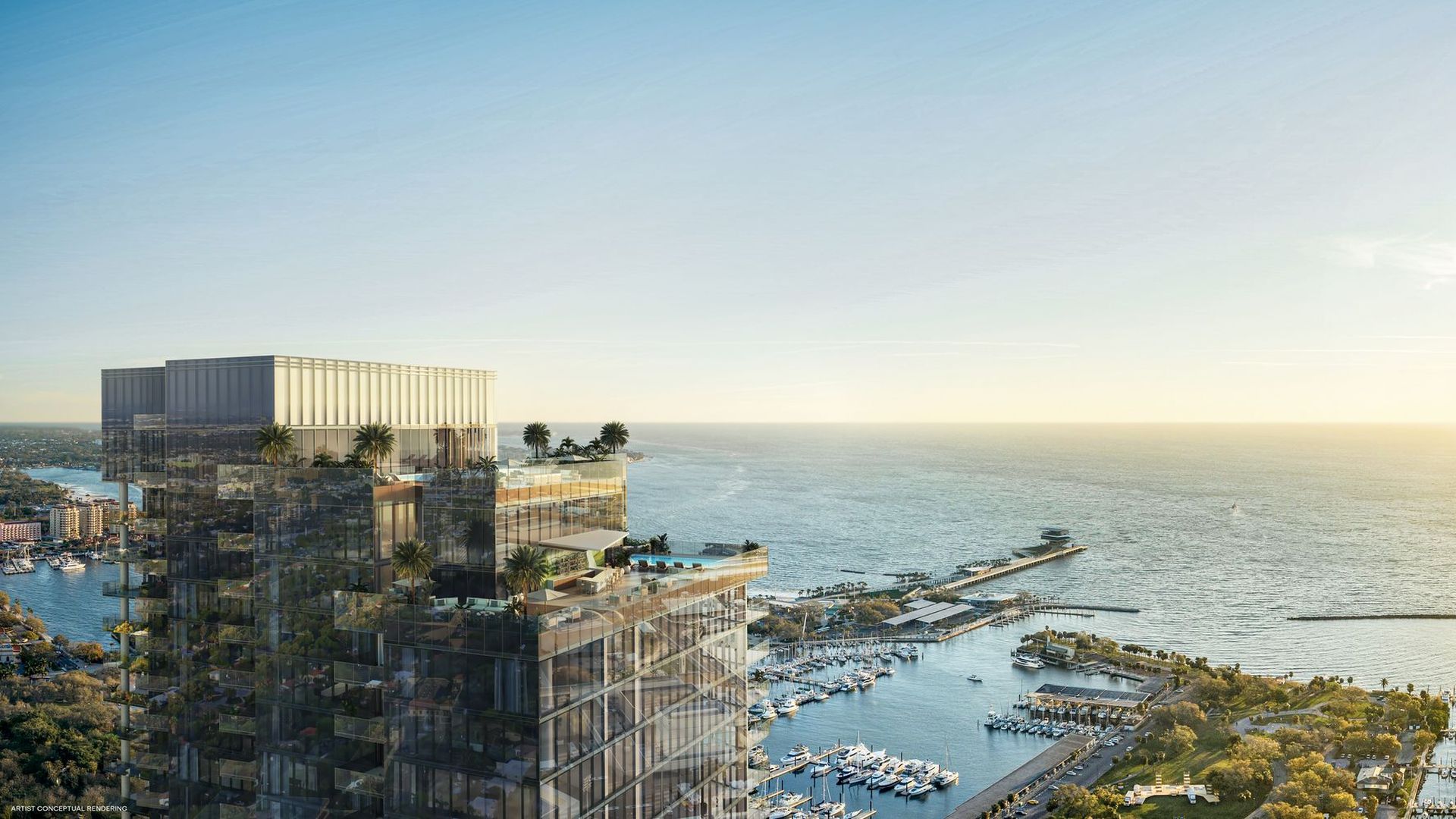 Glass skyscraper with rooftop pool and palm trees overlooking a marina filled with boats and a calm ocean at sunset under a clear blue sky.
