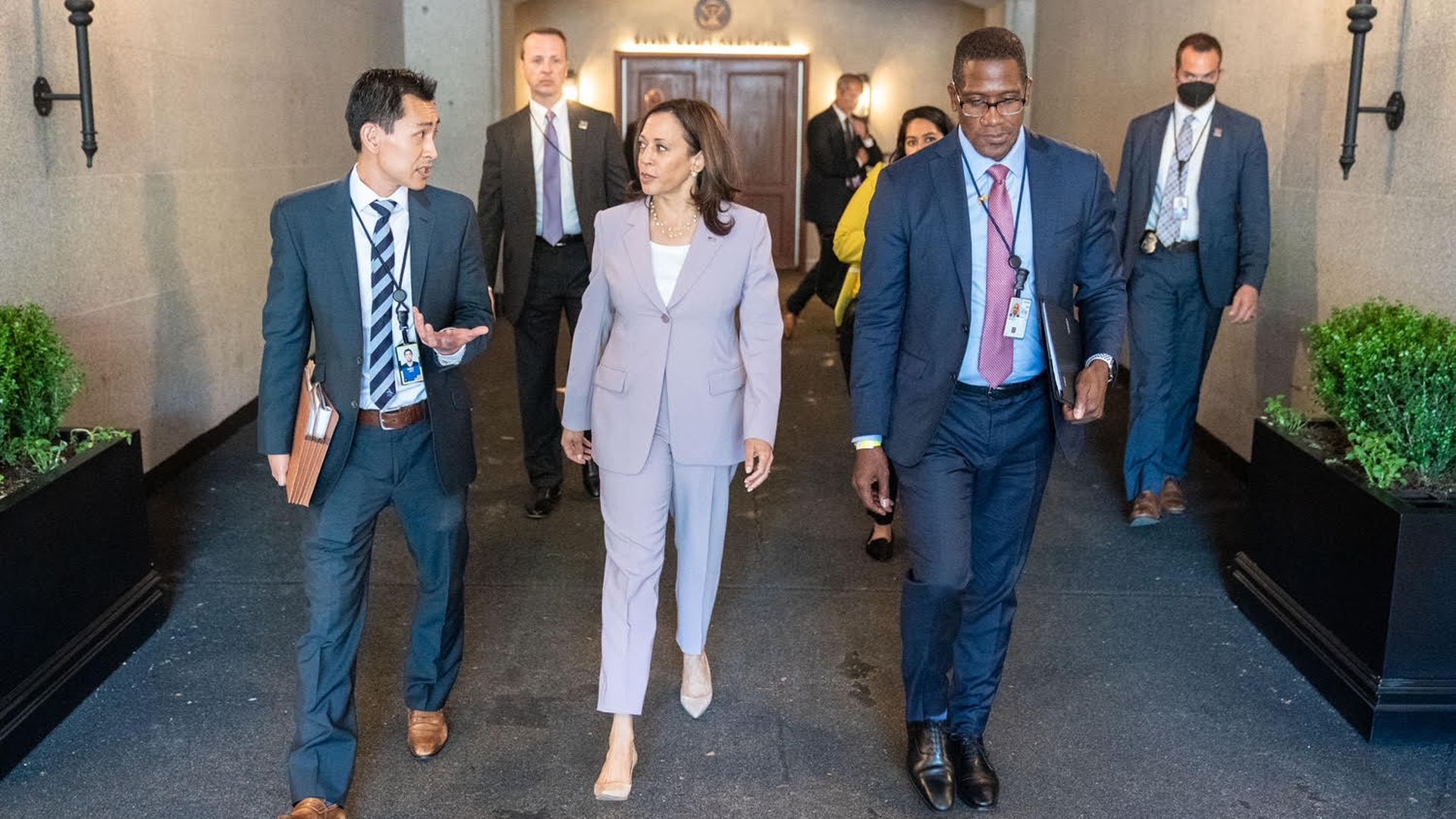 Josh Hsu talks to Vice President Kamala Harris while walking. 