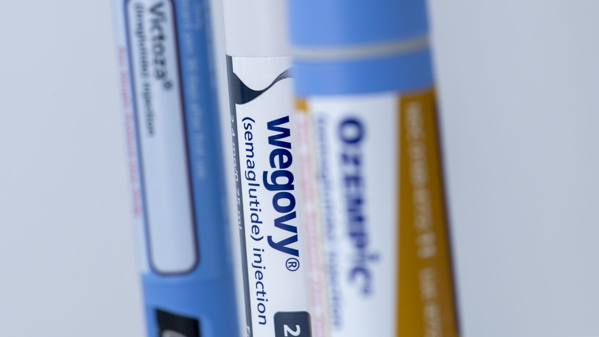 Three injectable vials of weight loss drugs