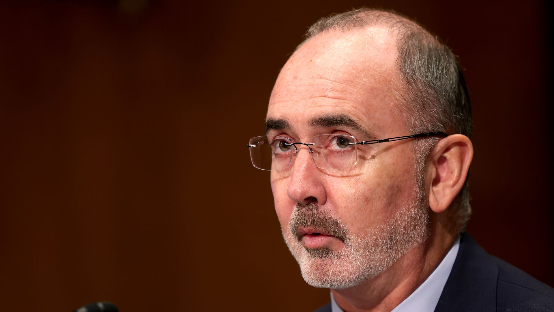 Shawn Fain listens at a congressional committee hearing.