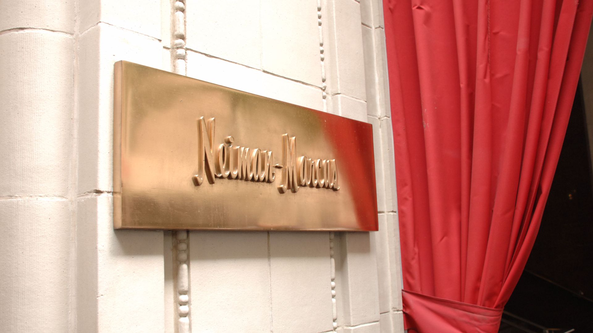 A gold sign that reads Neiman Marcus