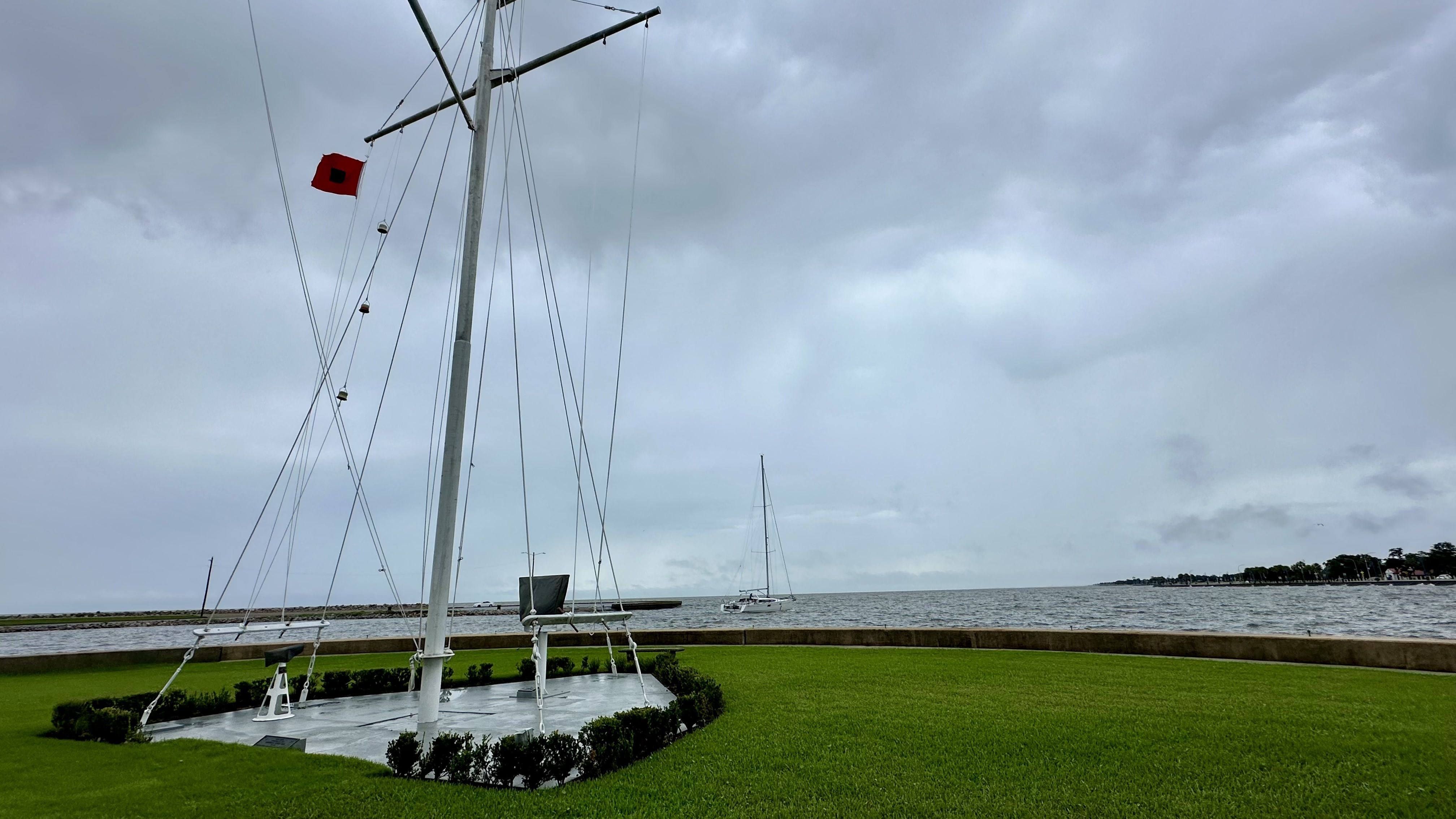 Photo shows a tropical storm warning flag flying at the lakefront.