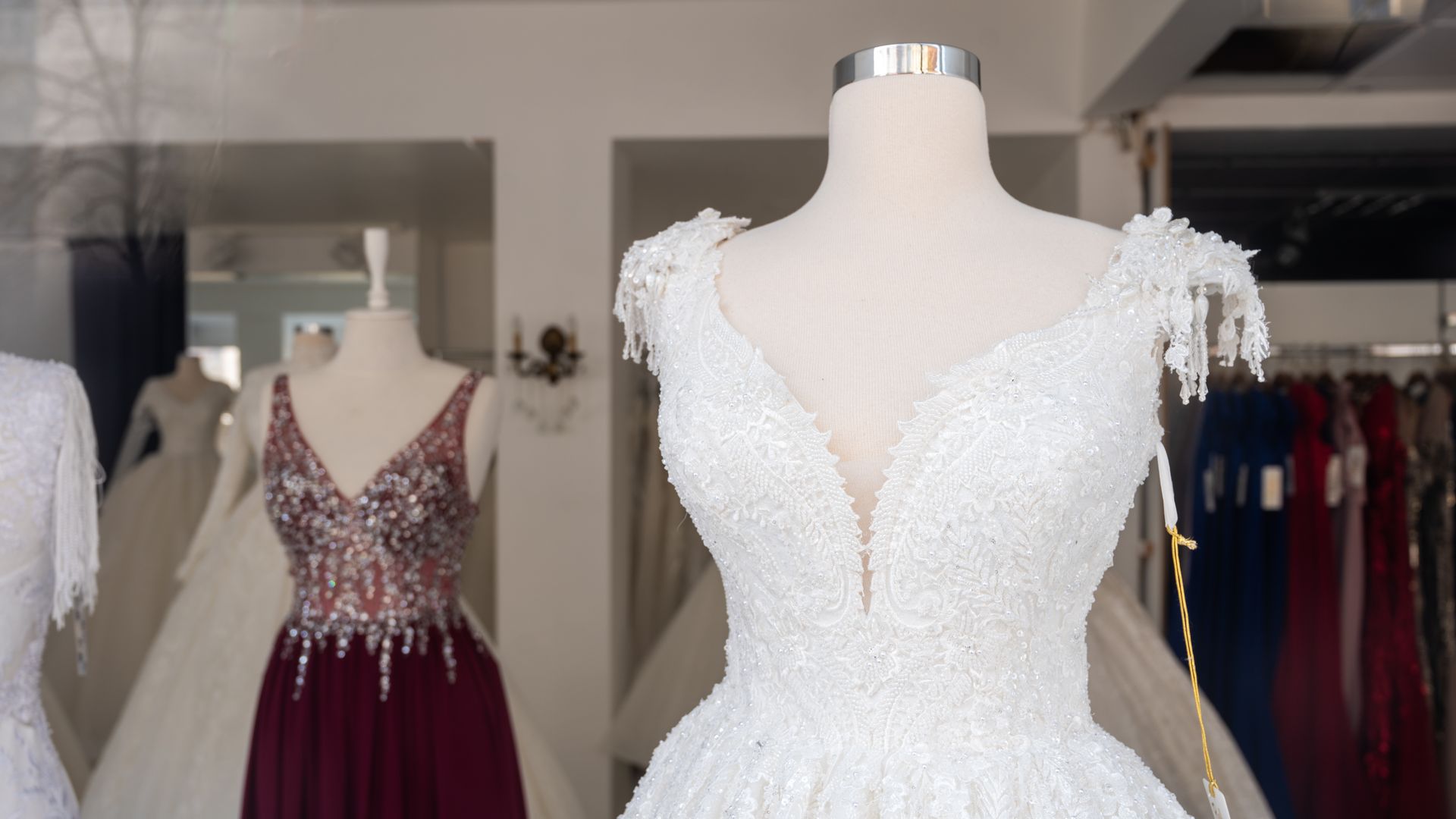 A wedding dress in a storefront.