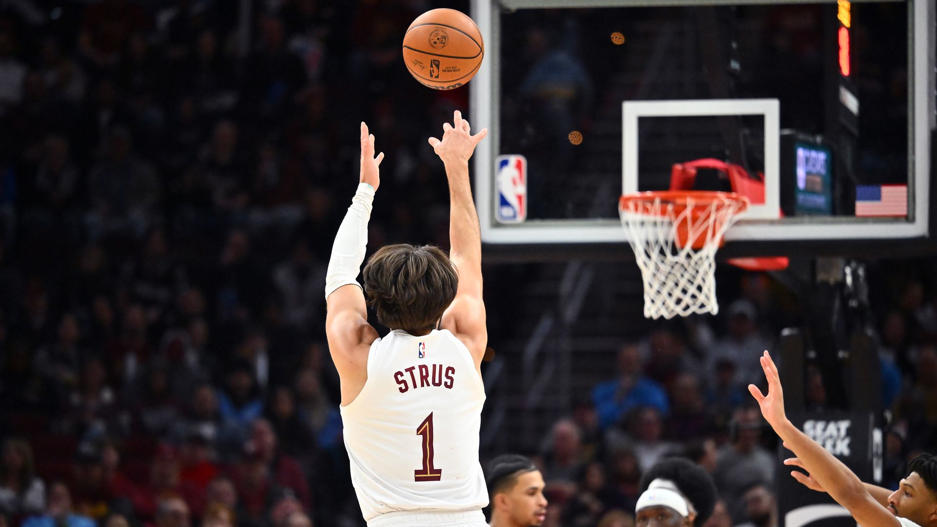 Image of Max Strus shooting basketball from behind. White jersey. 