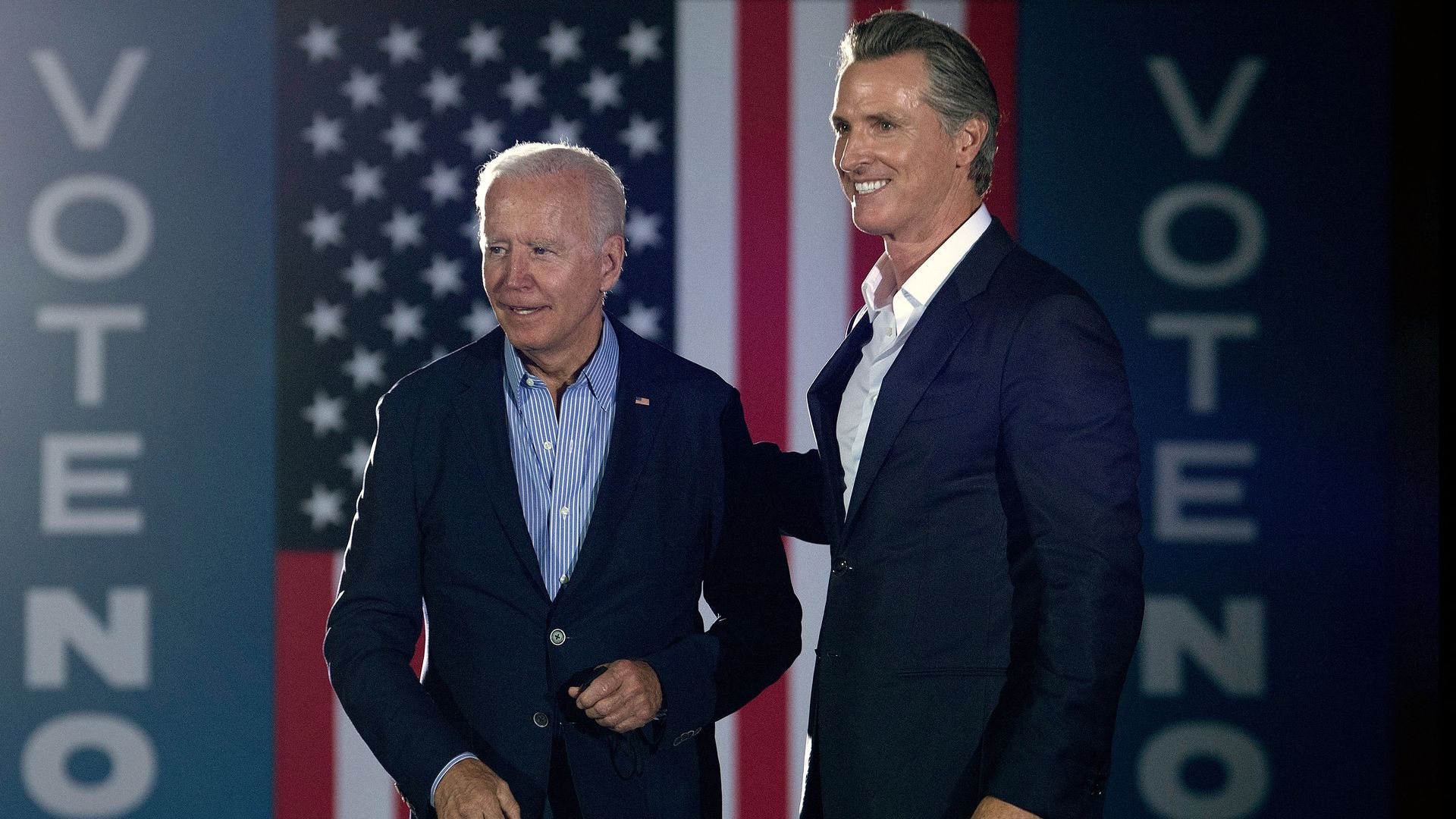 California Governor Gavin Newsom (L) greets US President Joe Biden during a campaign event at Long Beach City Collage in Long Beach, California on September 13