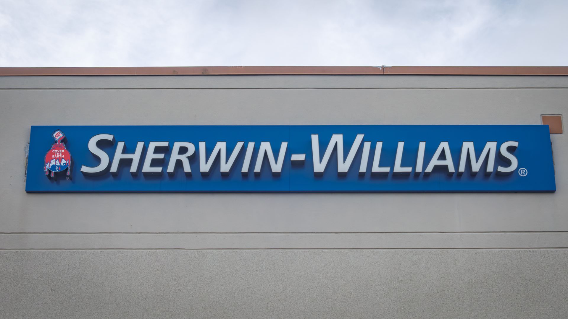 Sherwin-Williams sign in white lettering on blue background