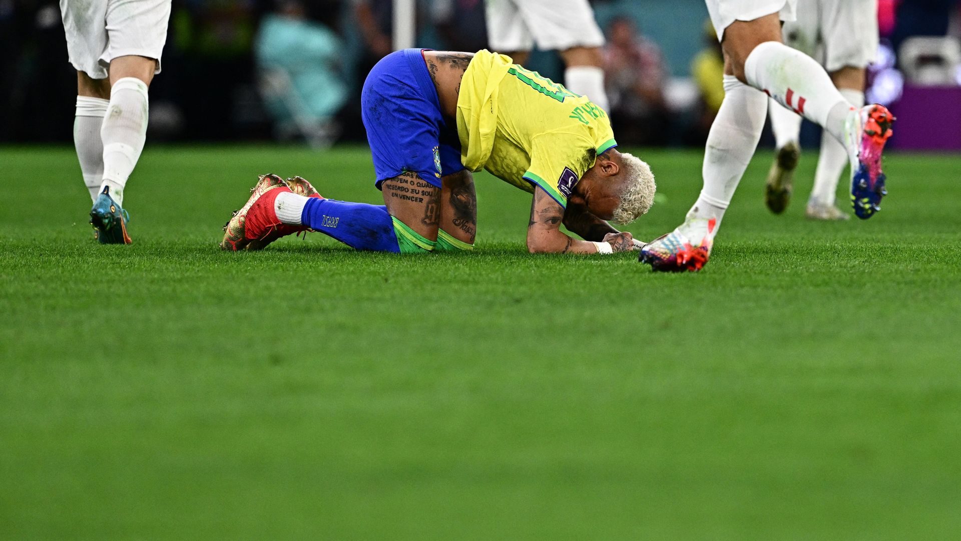 Neymar gestures on the ground during the Qatar 2022 World Cup.