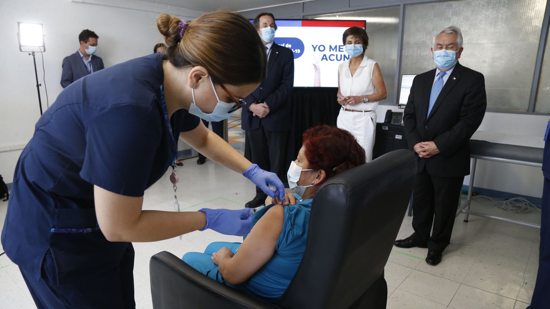 Picture of a patient receiving the Pfizer-BioNTech coronavirus vaccine in Santiago, Chile.