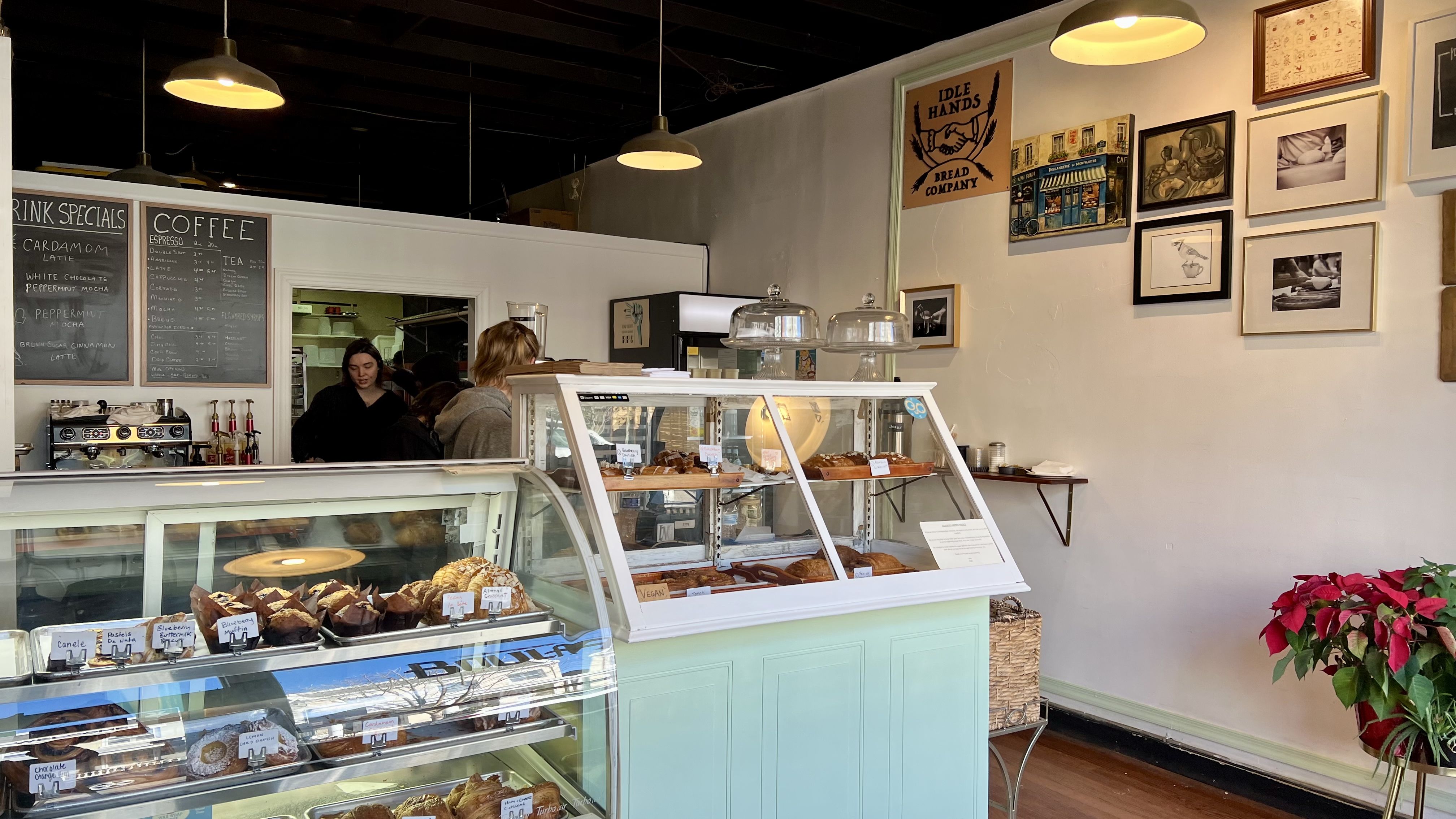 A photo showing a bakery with stacks of pastries lined up beside each other.