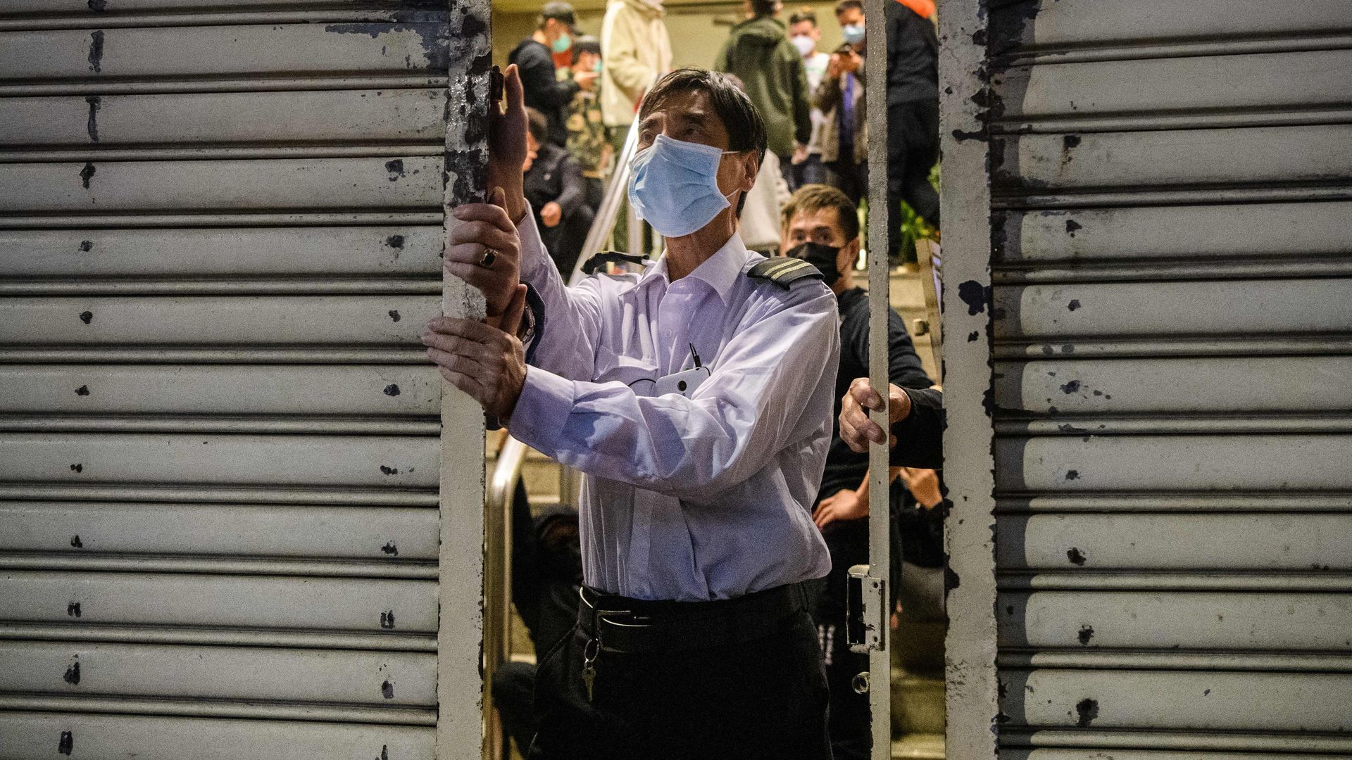A security guard wearing a face mask as a preventative measure