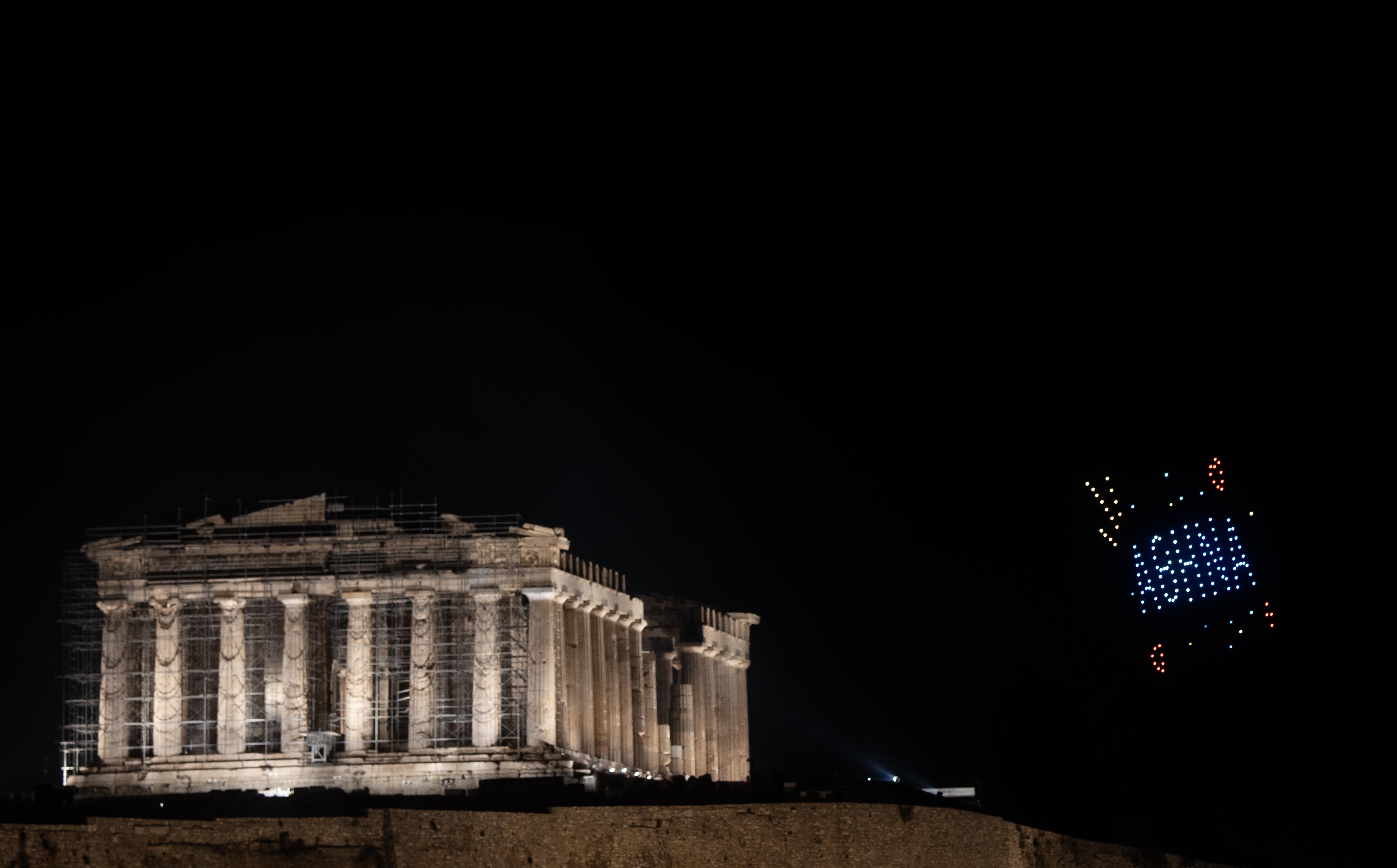 Drones form ''Athens'' next to the ancient Parthenon temple atop the Acropolis during New Year celebrations in Athens, Greece, on January 1, 2025. 
