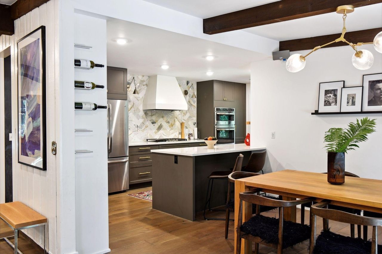 modern kitchen that opens to dining room