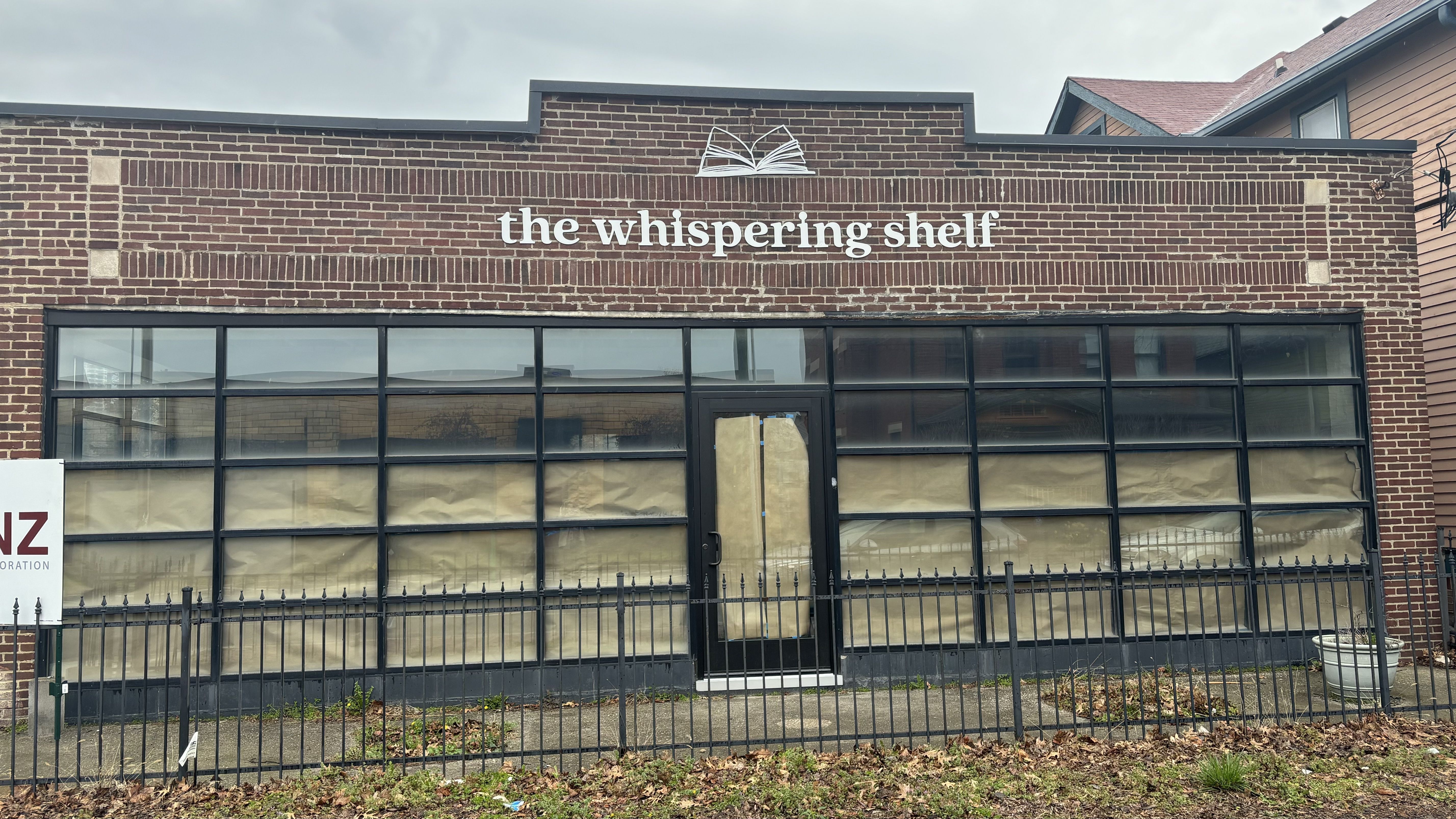 A store front that says the whispering shelf