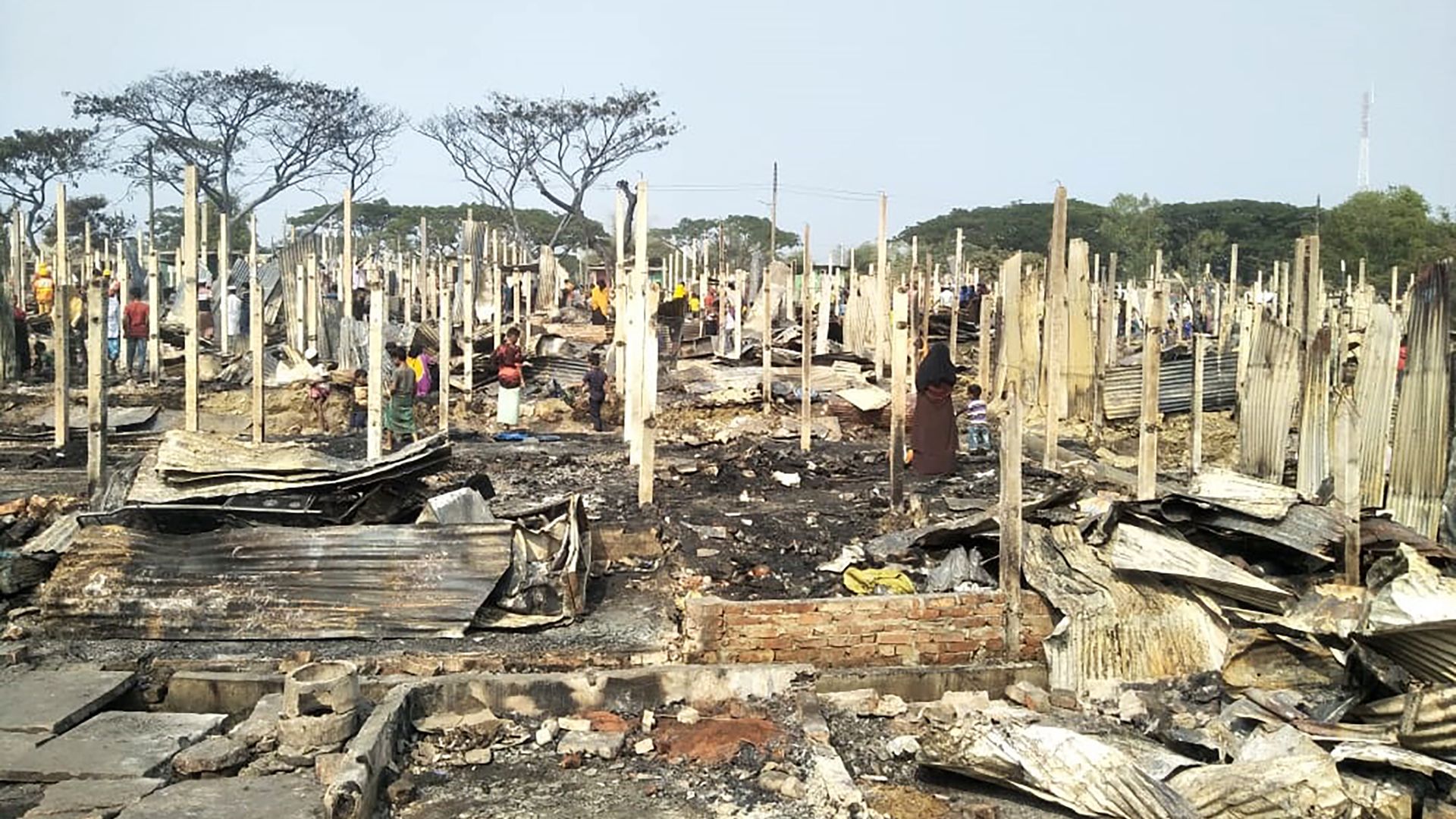 Photo of wreckage left over from a fire at a refugee camp