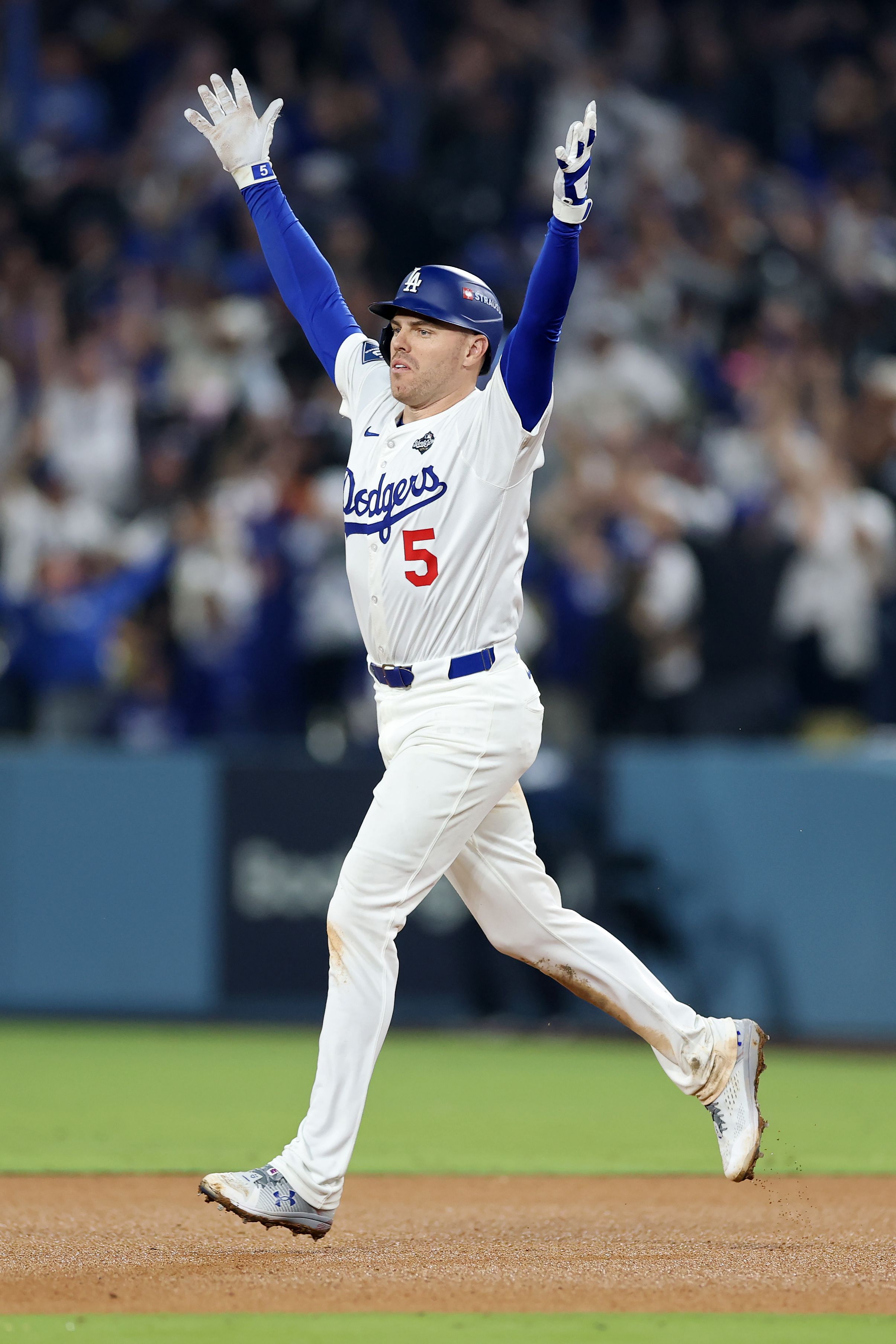 The Dodgers' Freddie Freeman rounds the bases after hitting a walk-off home run in the 18th inning against the Toronto Blue Jays during World Series Game 3 at Dodger Stadium.